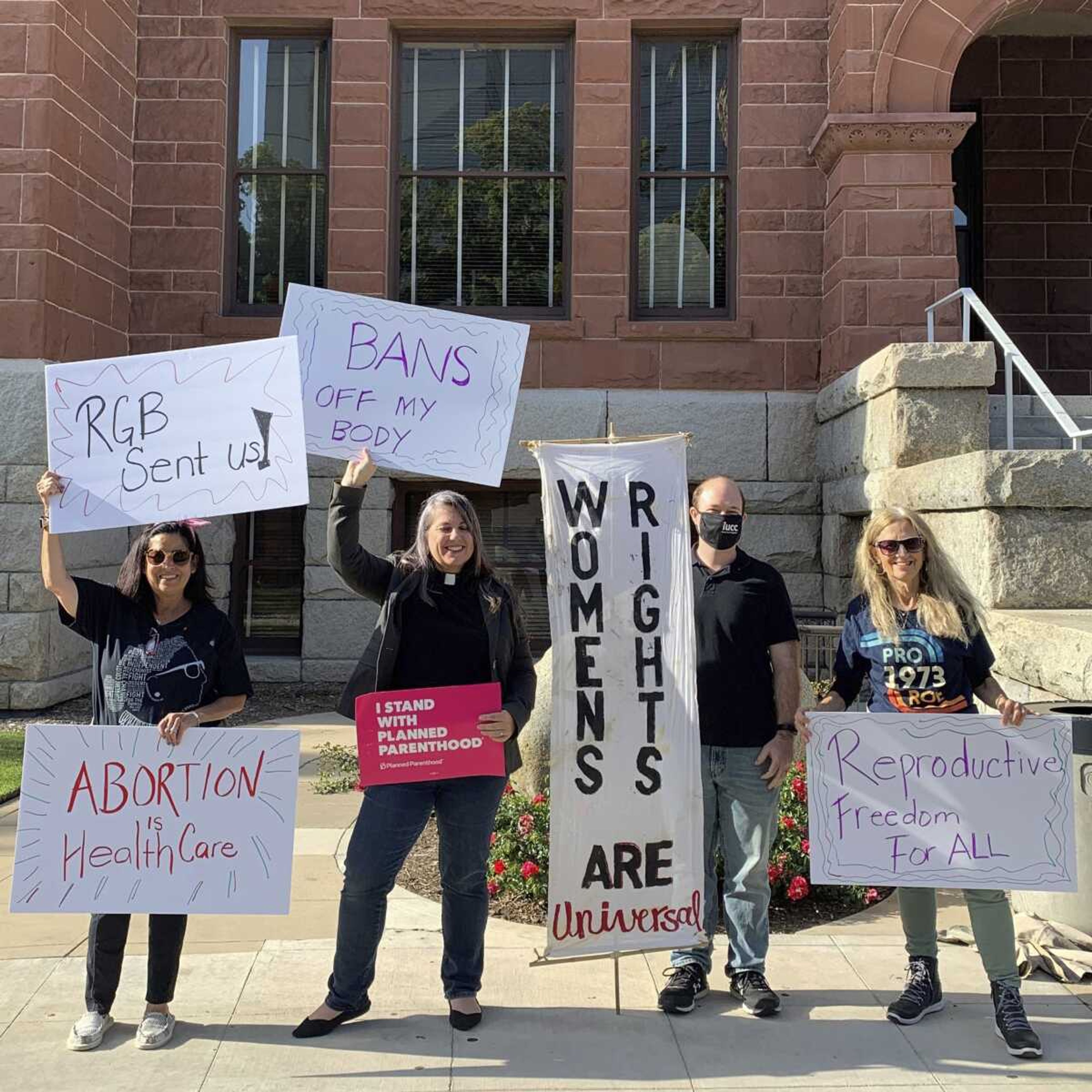 The Rev. Sarah Halverson-Cano, second from left, senior pastor of Irvine United Congregational Church in Irvine, California, leads congregants during a rally supporting abortion access Tuesday in Santa Ana, California.