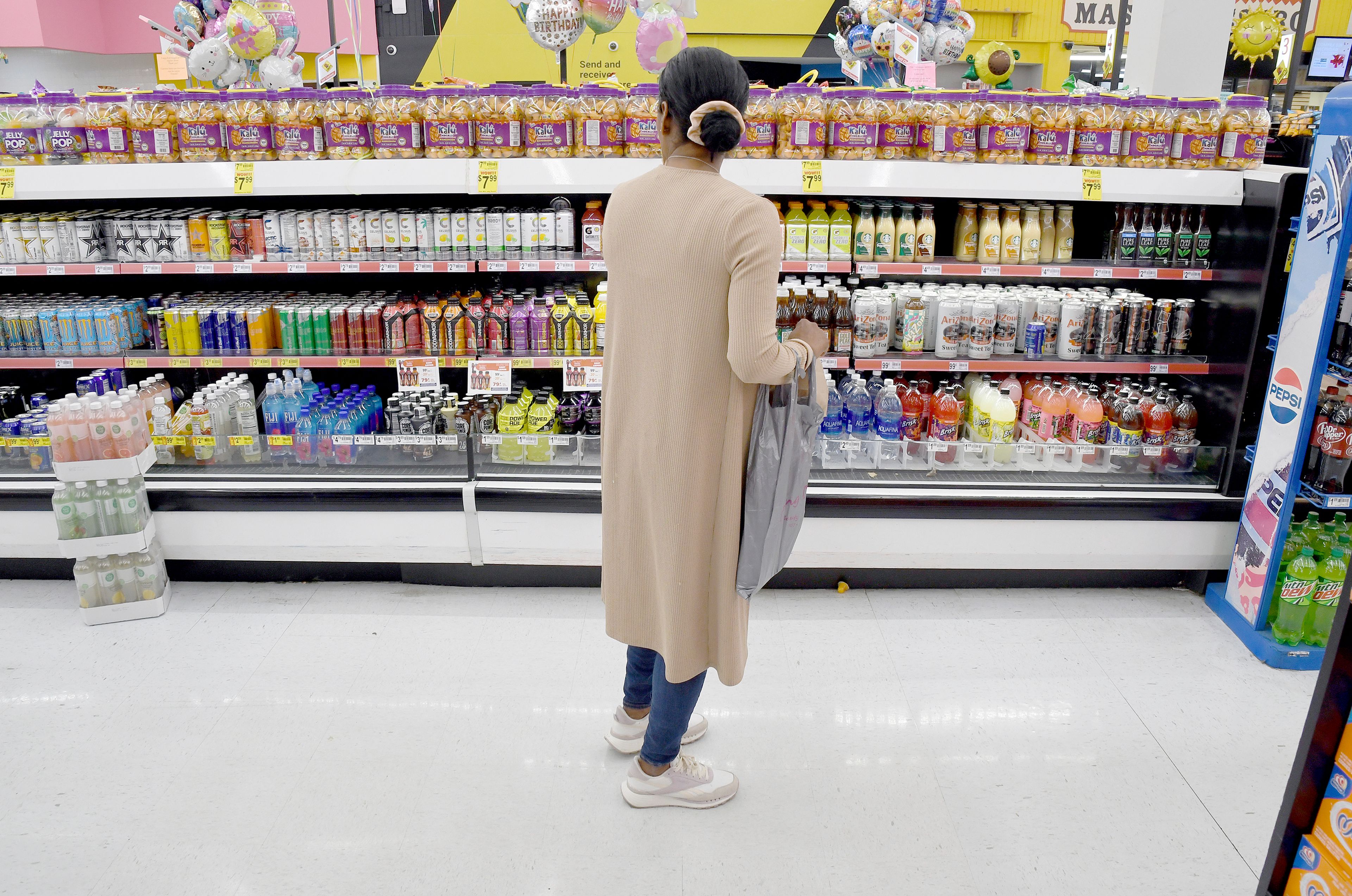 Sofia Roca shops on East Colfax Avenue in Aurora, Colorado, on March 29, 2024. (AP Photo/Thomas Peipert)