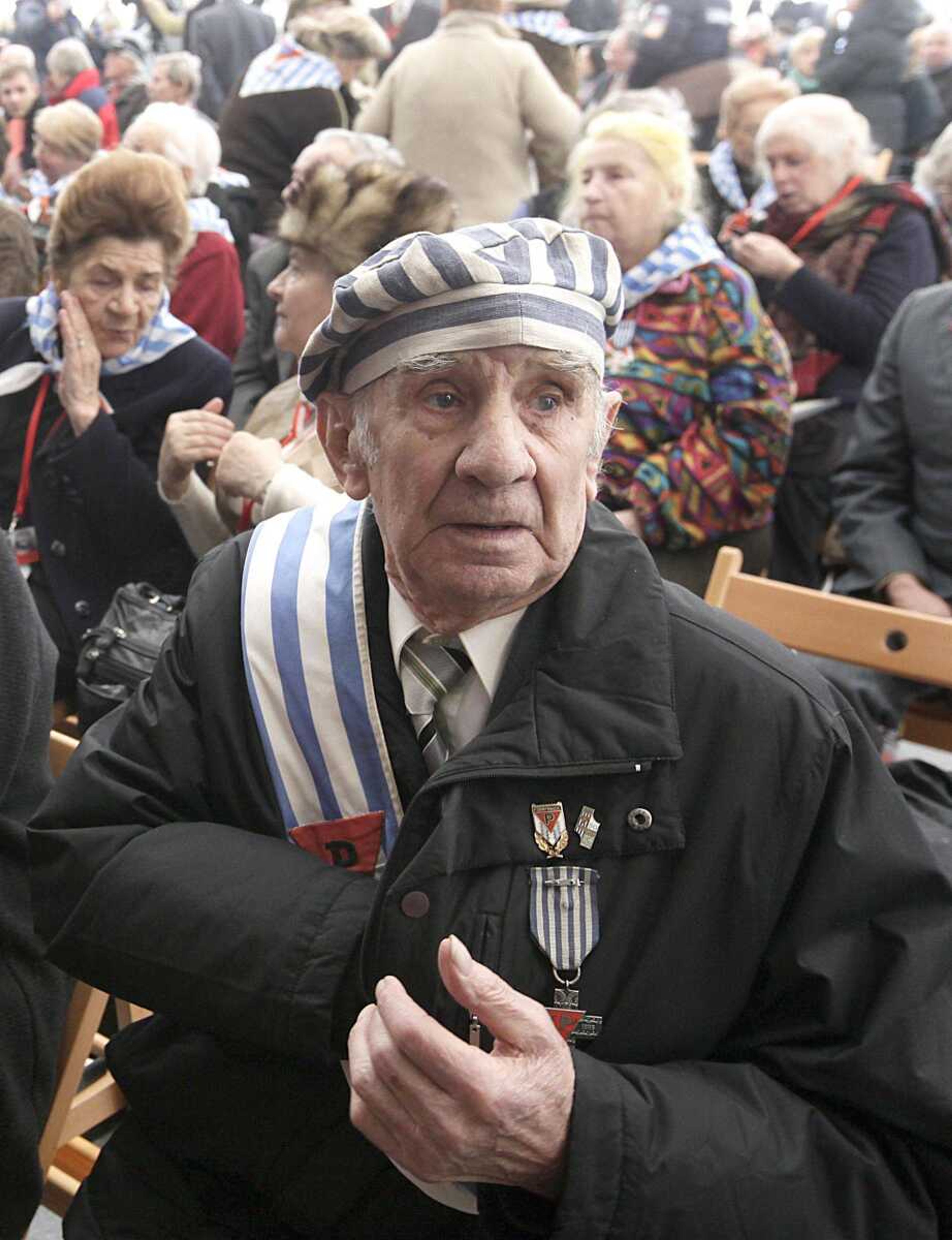 Former prisoner Miroslaw Celka, 89, attends a ceremony at the Auschwitz concentration camp Sunday in Oswiecim, Poland, marking the 68th anniversary of the liberation of Auschwitz by Soviet troops and remembering the victims of the Holocaust, in Auschwitz-Birkenau. (Czarek Sokolowski ~ Associated Press)