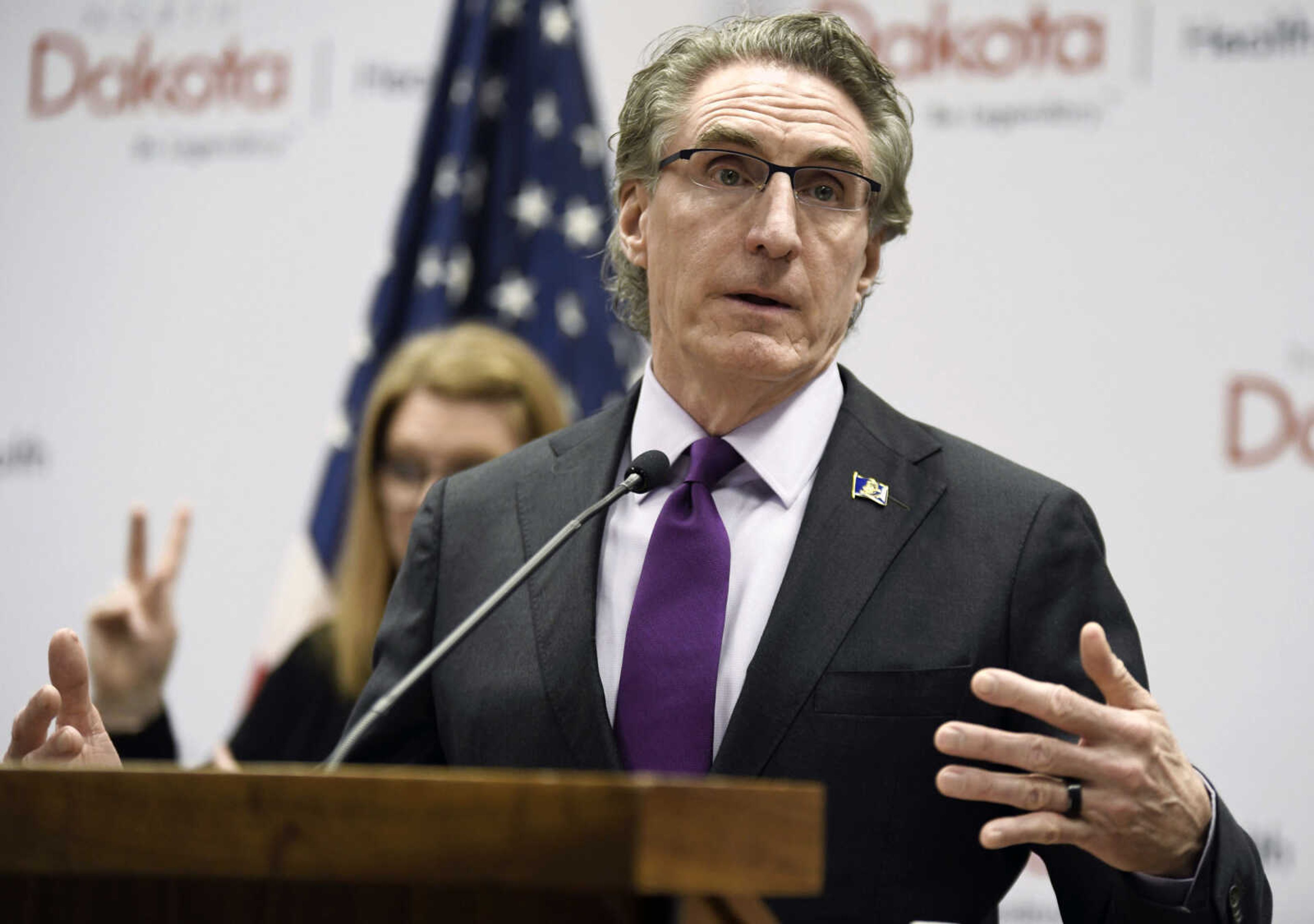 FILE - North Dakota Gov. Doug Burgum speaks at the state Capitol on April 10, 2020, in Bismarck, N.D. On Tuesday, April 11, 2023, Burgum signed two transgender athlete bans into law, effectively prohibiting transgender girls and women from joining female sports teams in K-12 and college. (Mike McCleary/The Bismarck Tribune via AP, File)