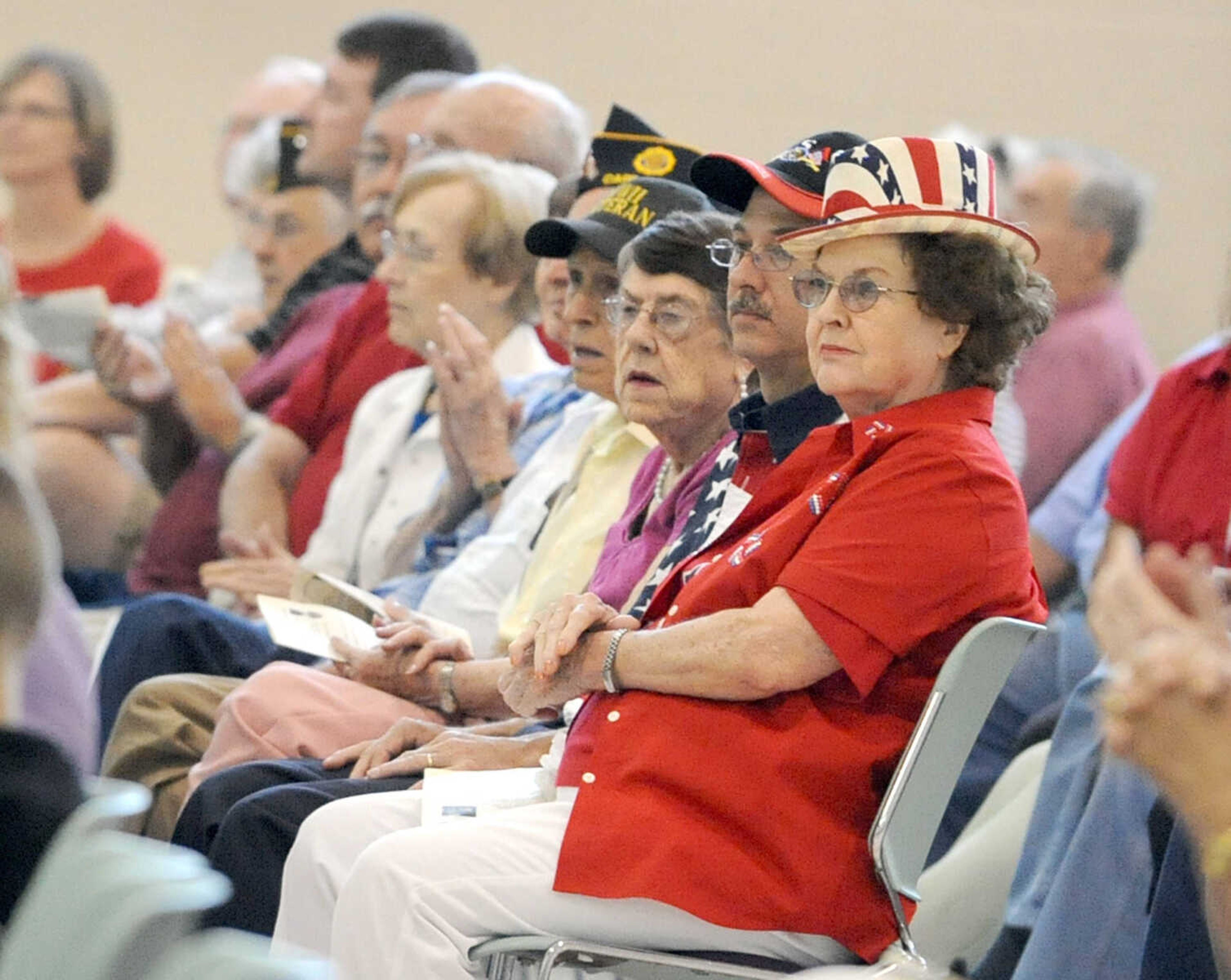 LAURA SIMON ~ lsimon@semissourian.com
People listen to the Cape Girardeau Municipal Band perform Monday, May 28, 2012 during the Joint Veterans Council Memorial Service at the Osage Centre in Cape Girardeau.