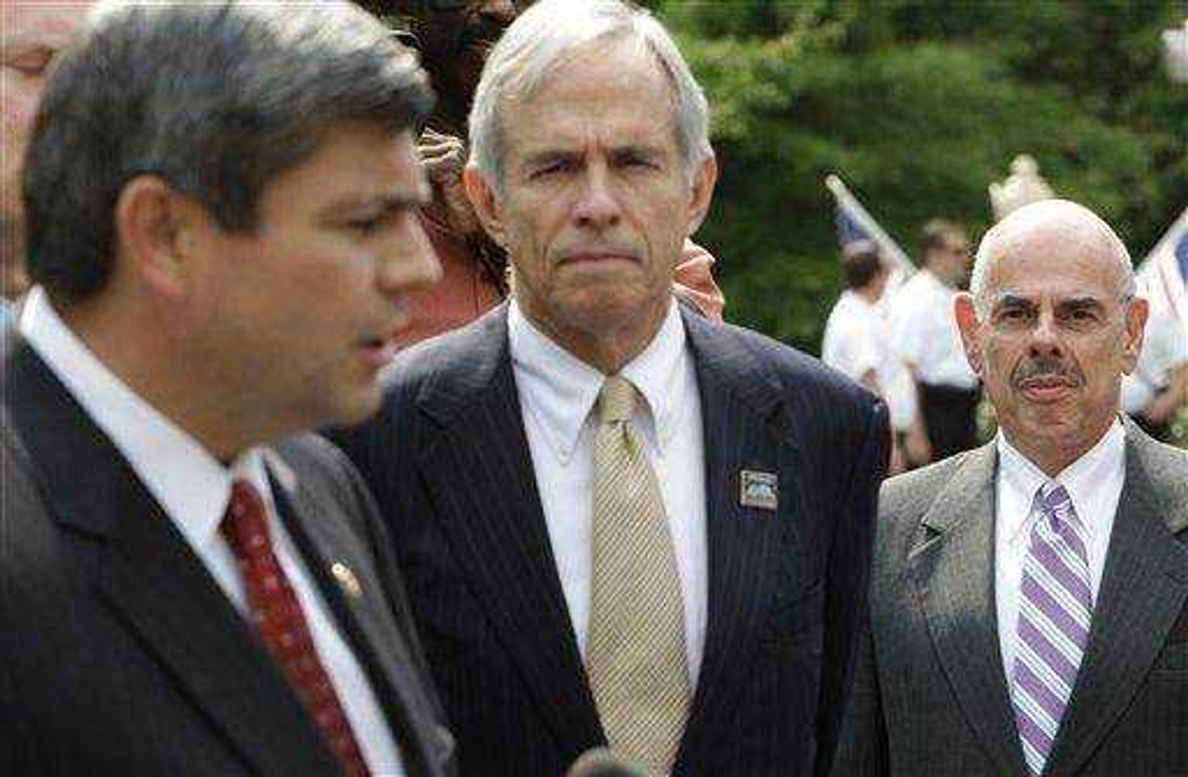 Rep. Henry Waxman, D-Calif., right watches as Rep. Mike Ross, D-Ark., left, speaks to the media, with Rep. Bart Gordon, D-Tenn., after a Blue Dog Democrats meeting with President Barack Obama at the White House in Washington July 21.(AP Photo/Alex Brandon)