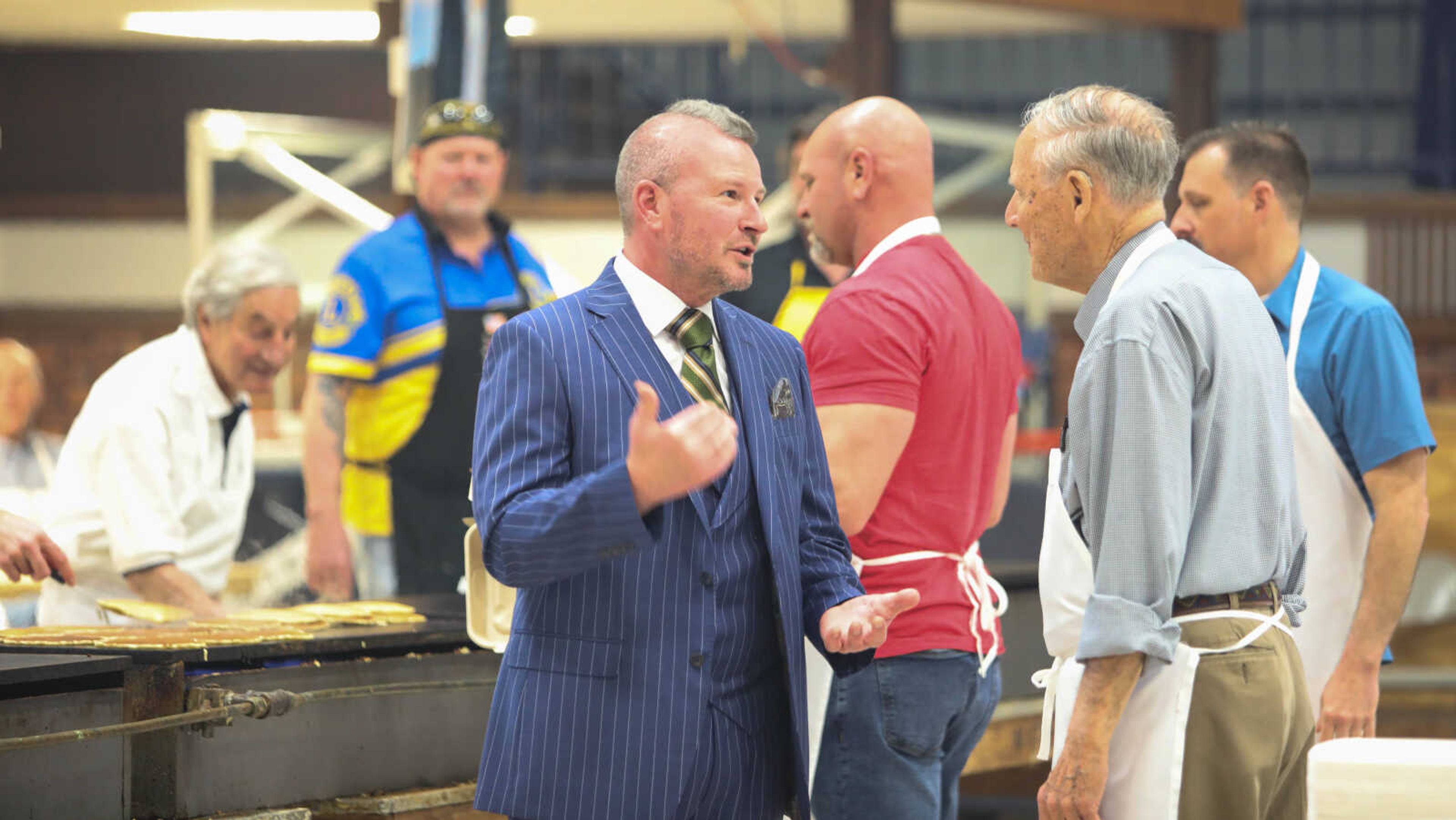 Eric Becking chats with Lions Club members.