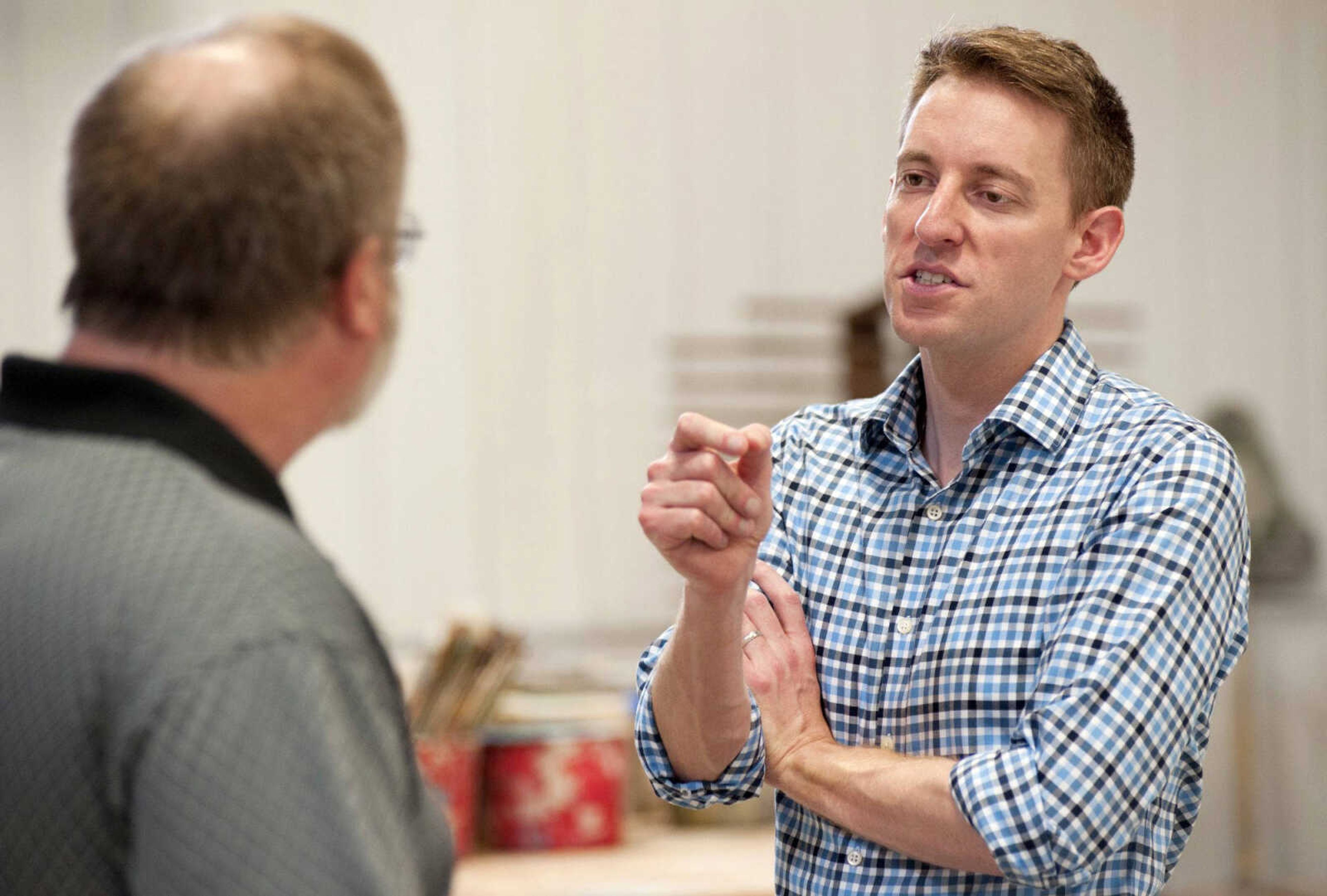 Missouri Secretary of State Jason Kander, right, a Democrat challenging incumbent Republican U.S. Sen. Roy Blunt, talks with International Union of Painters and Allied Trades District 58 instructor Kevin Harned during a tour of the IUPAT training facility Friday in the St. Louis suburb of Chesterfield, Missouri.