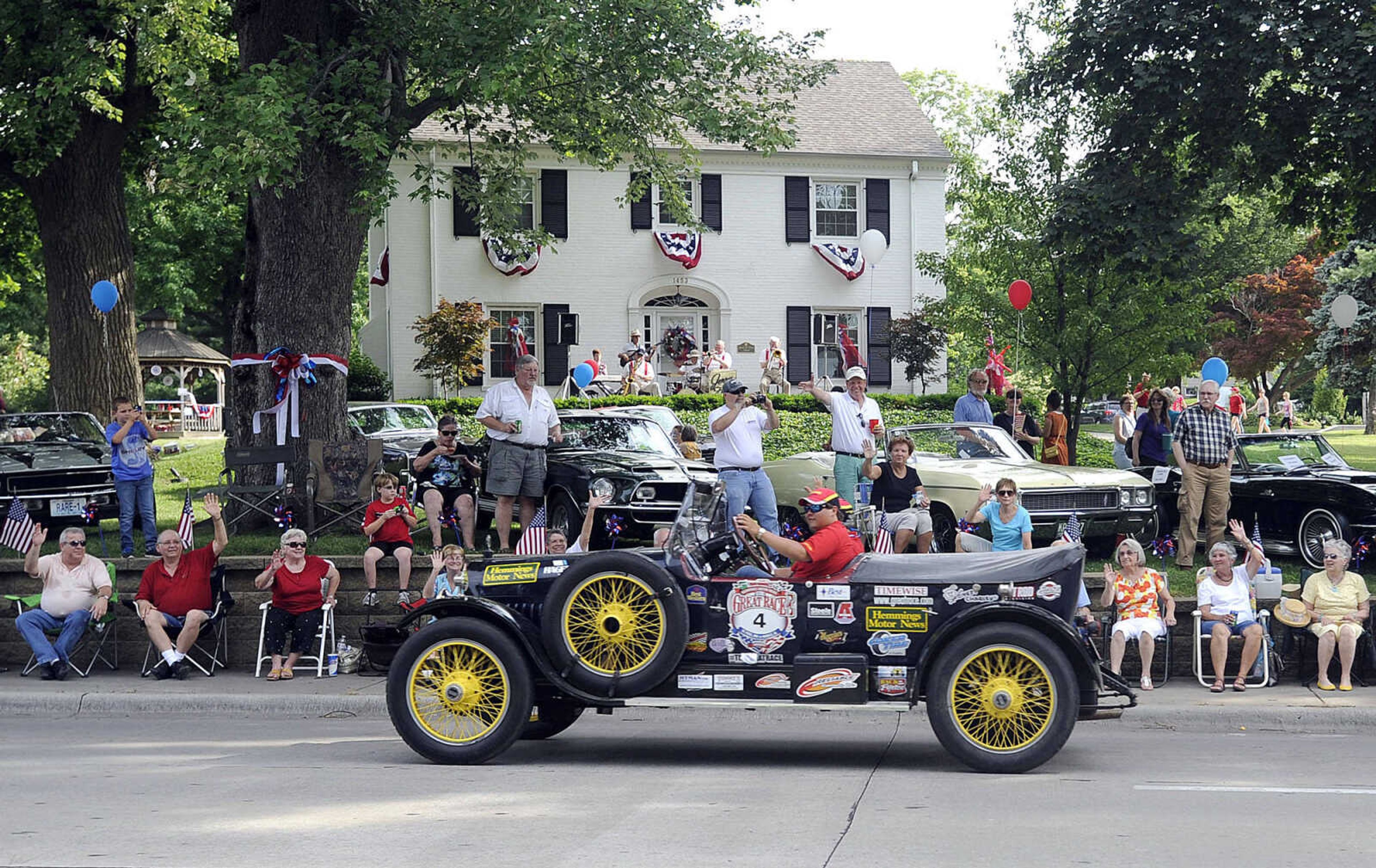 FRED LYNCH ~ flynch@semissourian.com
A crowd greets Dave Reeder as he drives a 1916 Hudson 4-passenger Speedster on Broadway toward the finish line downtown in the Hemming Motor News 2013 Great Race Tuesday, June 25, 2013 in Cape Girardeau.