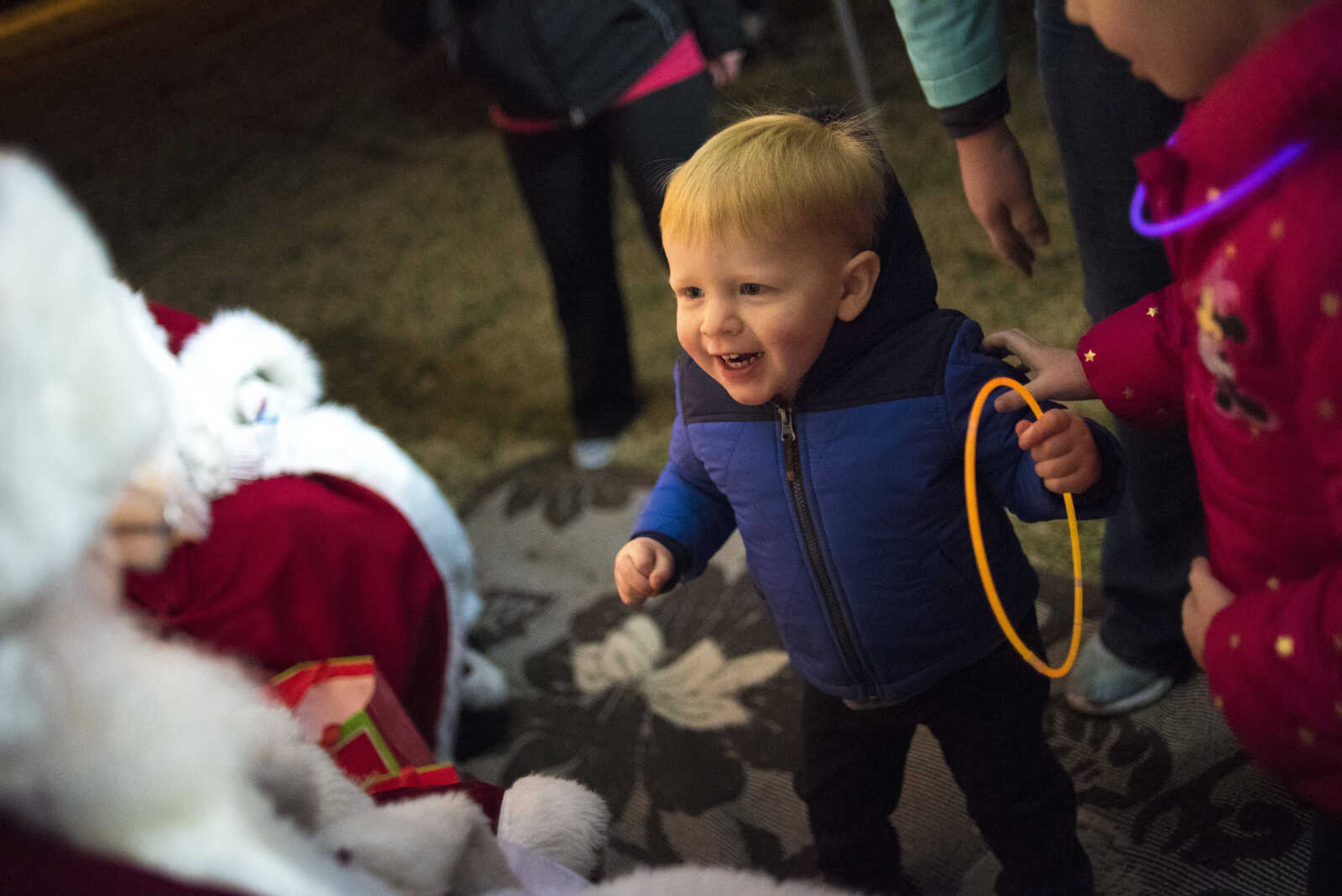 Luke Desautels, 23 months, smiles at Santa during the Jackson Holiday Extravaganza Friday, Nov. 24, 2017 at the Jackson City Park.