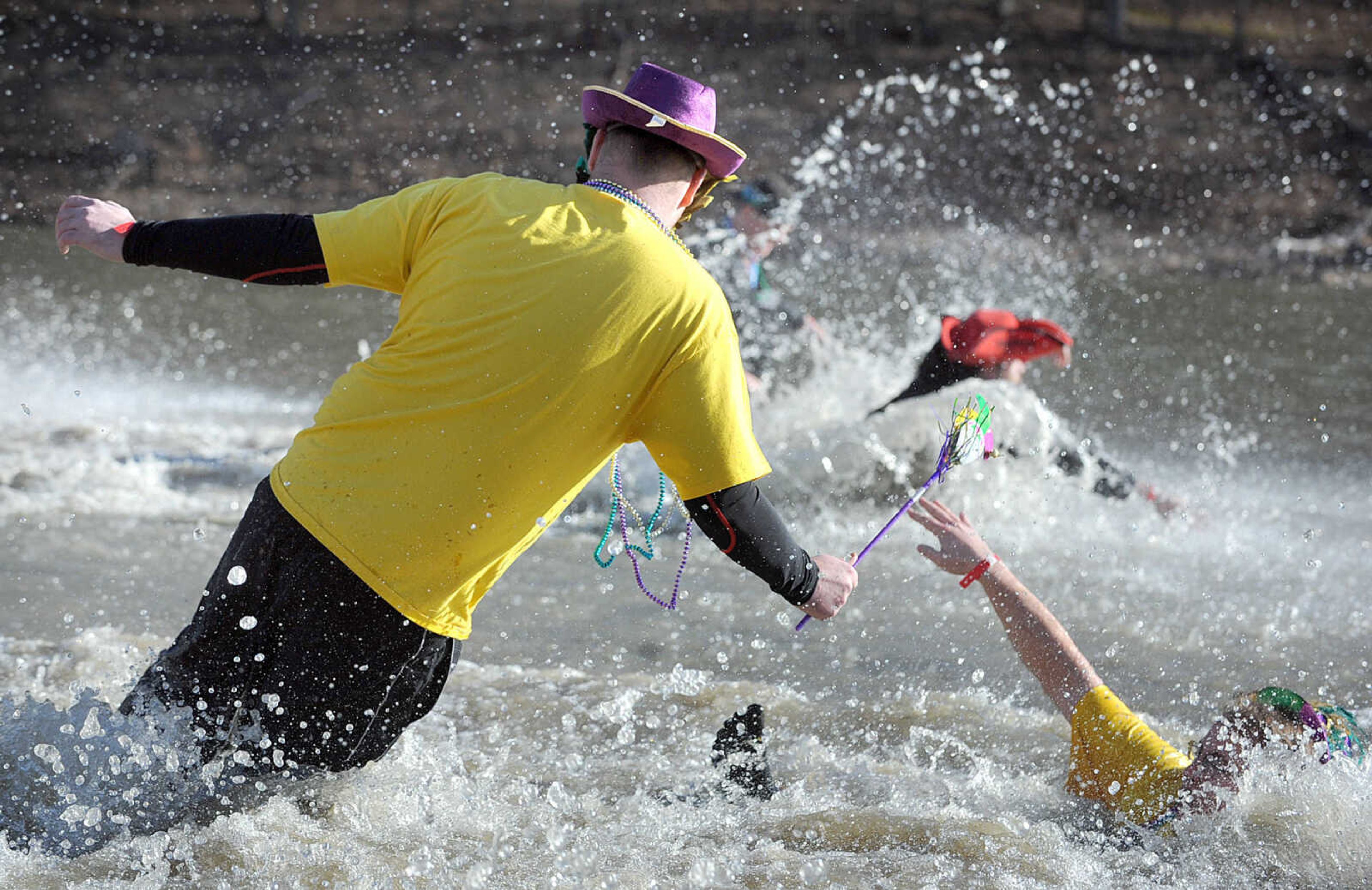 LAURA SIMON ~ lsimon@semissourian.com
People plunge into the cold waters of Lake Boutin Saturday afternoon, Feb. 2, 2013 during the Polar Plunge at Trail of Tears State Park. Thirty-six teams totaling 291 people took the annual plunge that benefits Special Olympics Missouri.