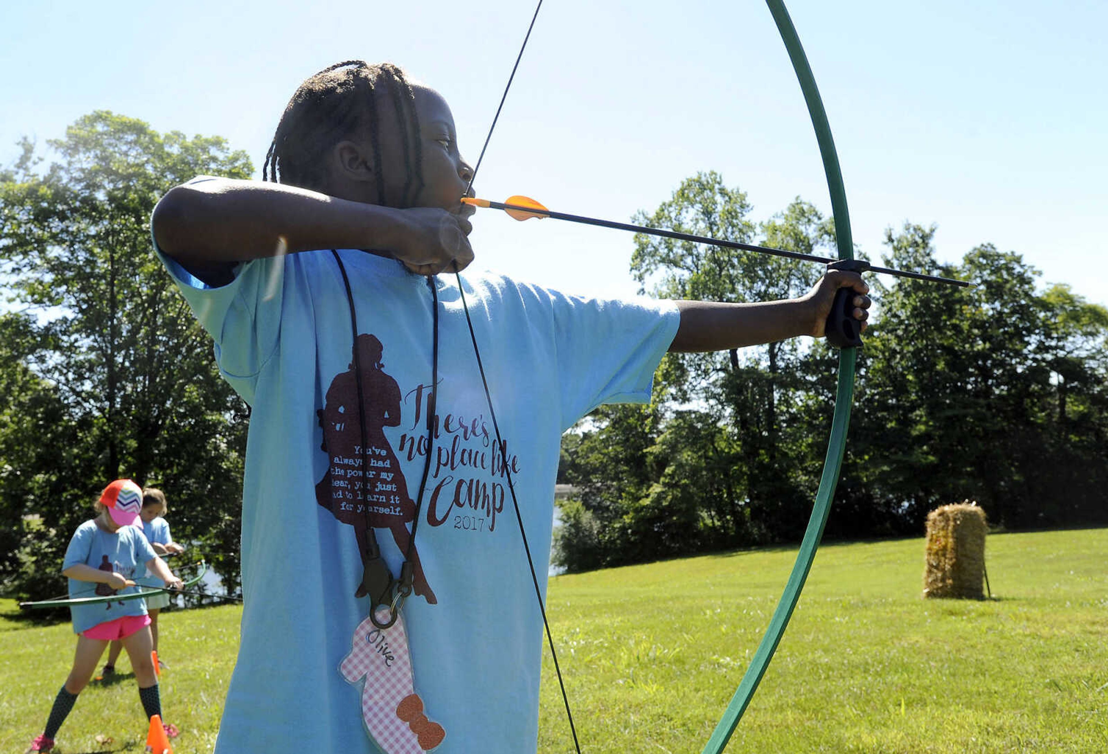 FRED LYNCH ~ flynch@semissourian.com
Brownie Girl Scout Olive Caruso sights a shot during archery class Thursday, June 8, 2017 during Girl Scout day camp at Elks Lake in Cape Girardeau.