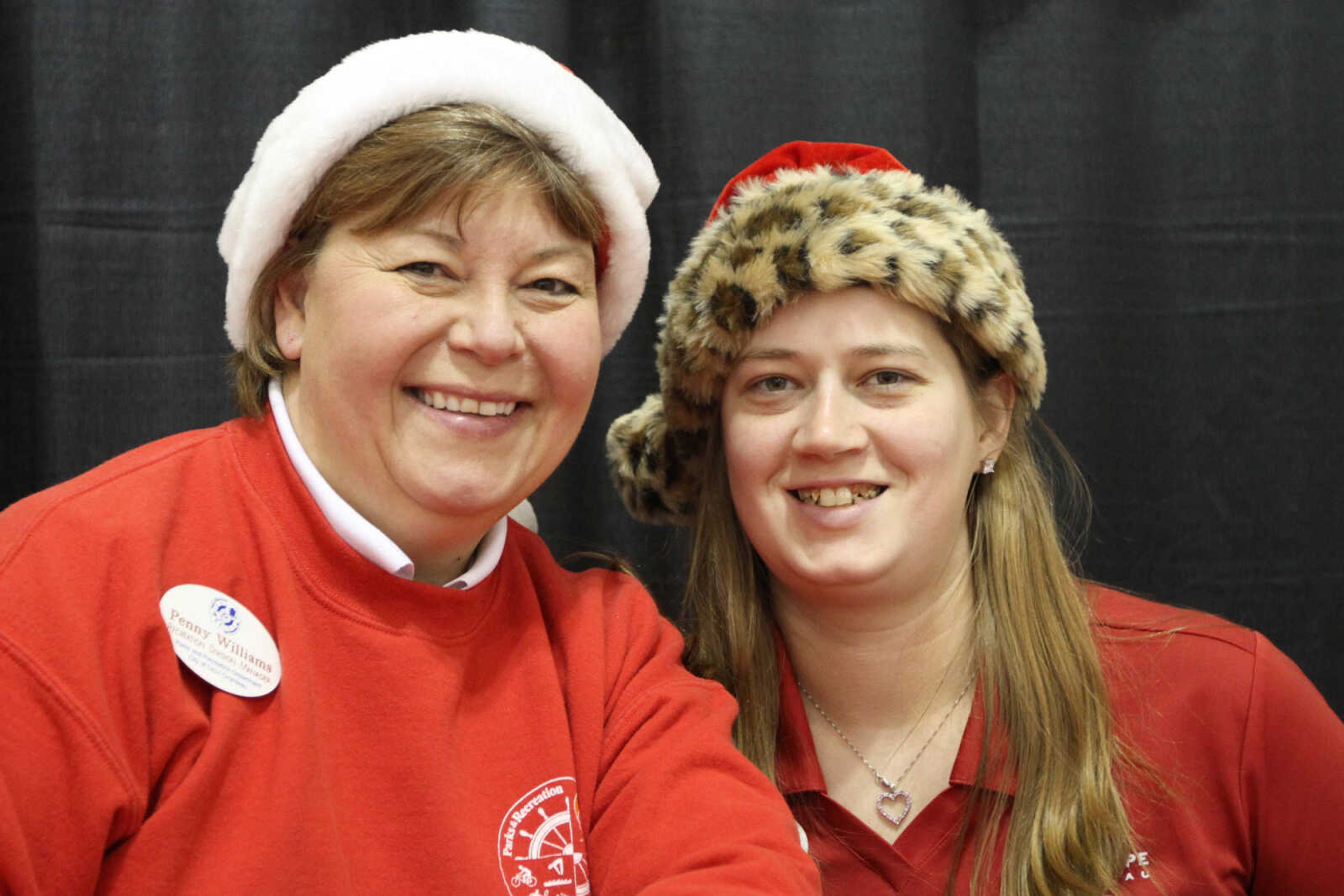 GLENN LANDBERG ~ glandberg@semissourian.com

Penny Williams, left, and Cassie Essner pose for a photo during a breakfast with Santa fundraiser for the Cape Girardeau Parks and Recreation Foundation Saturday, Dec. 13, 2014 at the Osage Centre.