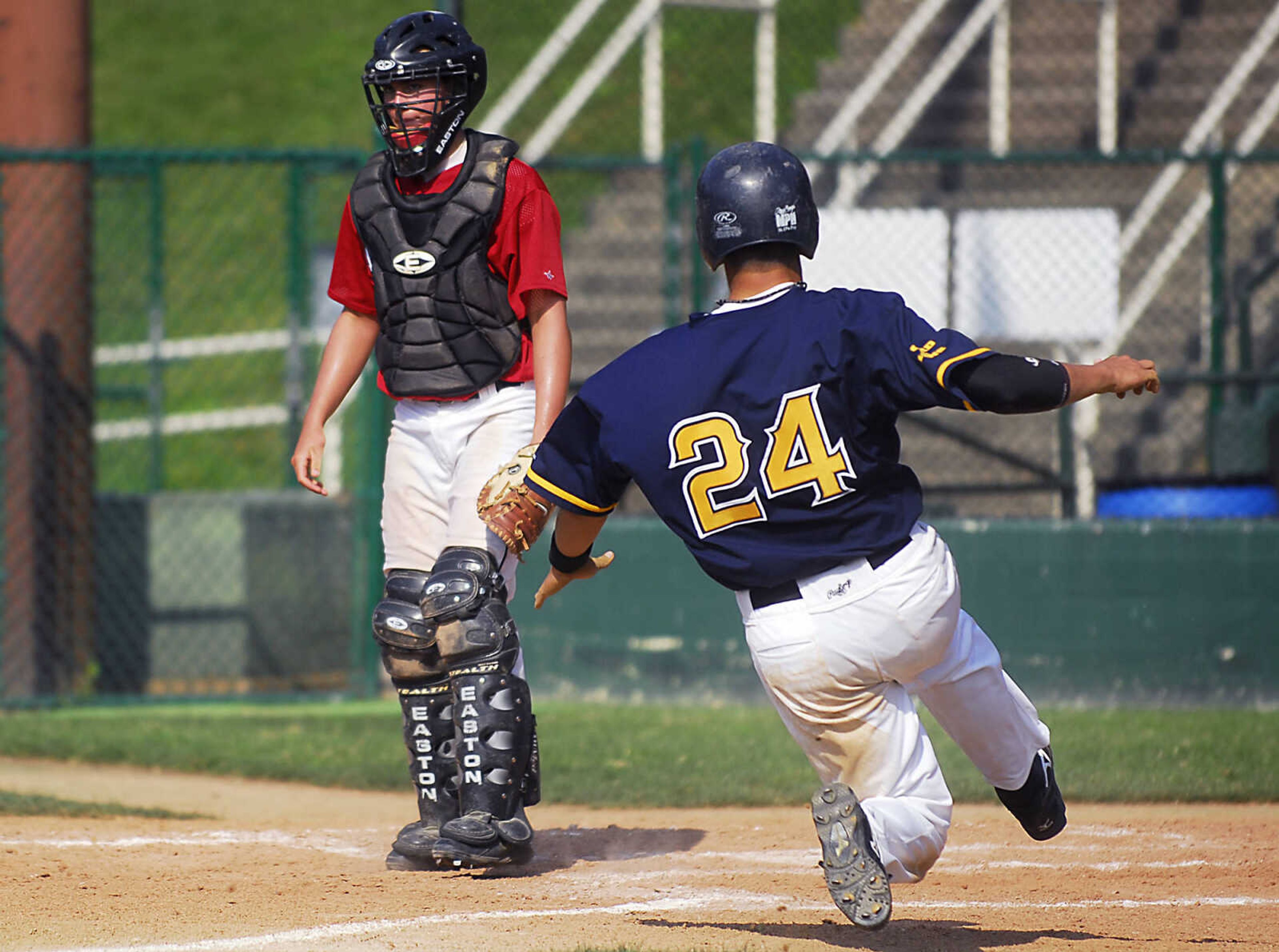 KIT DOYLE ~ kdoyle@semissourian.com
Cape Legion's Adam Kelley slides into home for a run Monday, July 13, 2009, at Capaha Field.