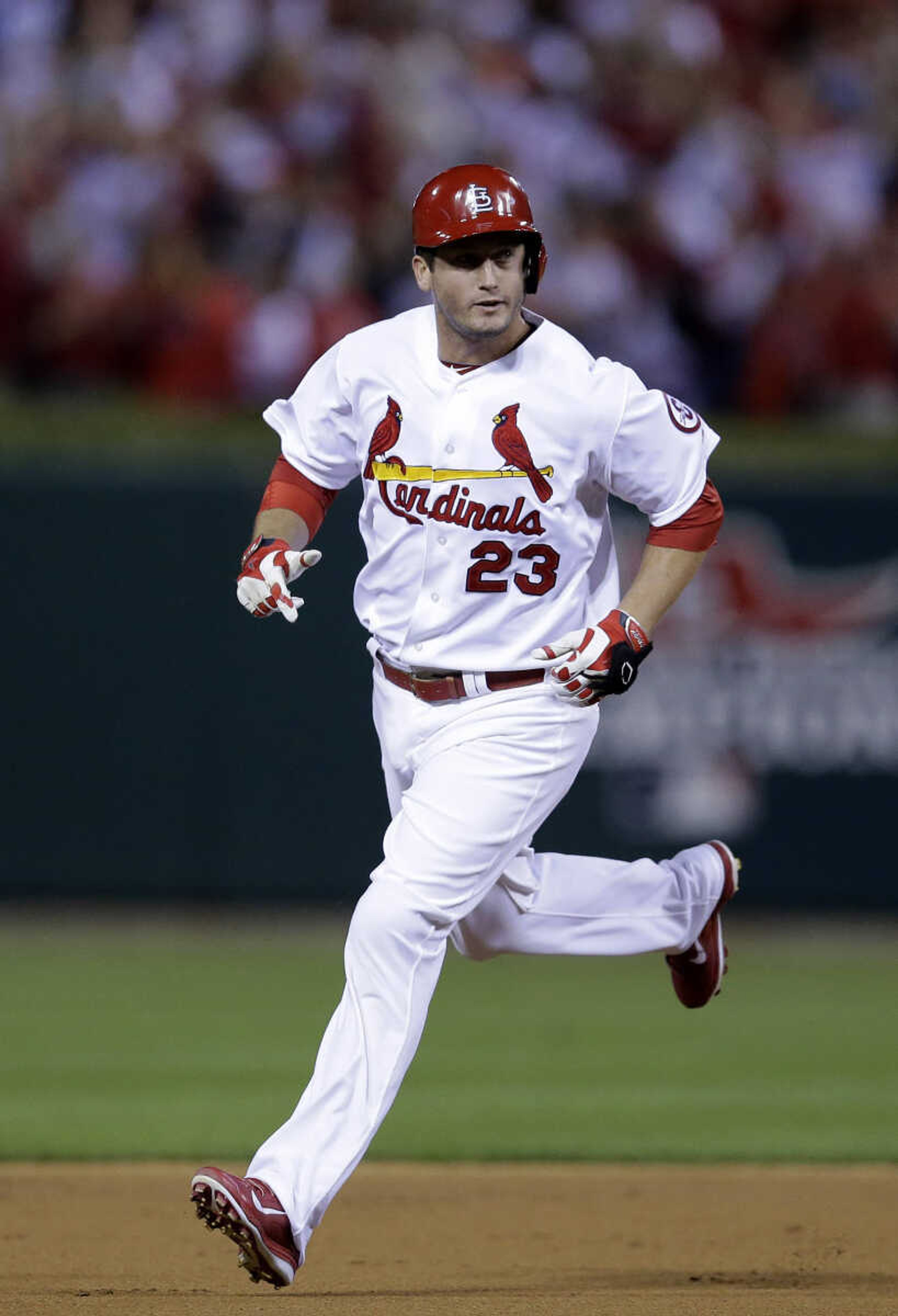 St. Louis Cardinals' David Freese rounds the bases after hitting a two-run home run against the Pittsburgh Pirates in the second inning of Game 5 of a National League baseball division series on Wednesday, Oct. 9, 2013, in St. Louis. (AP Photo/Charlie Riedel)