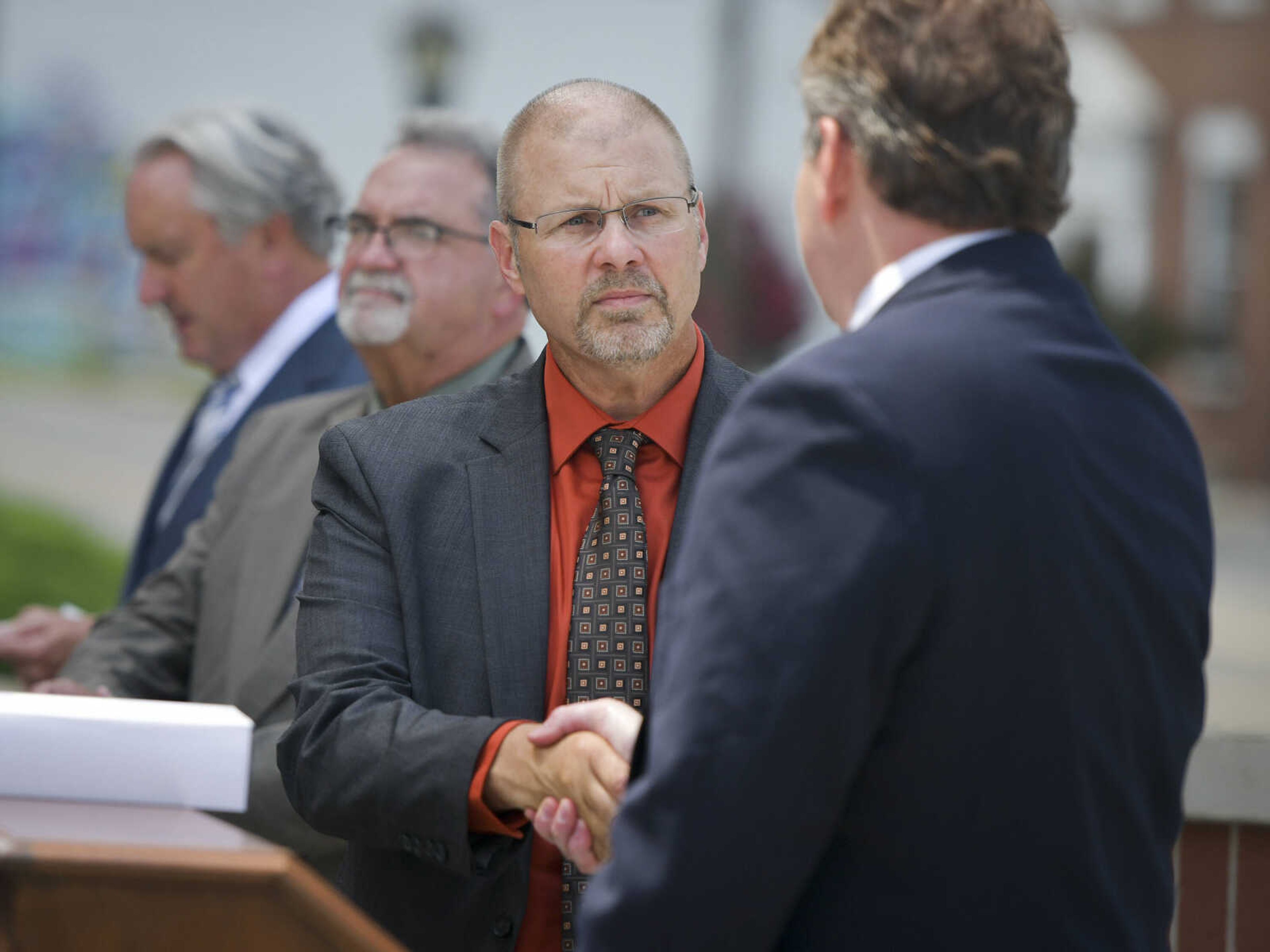 Perry County Sheriff's deputy and captain of operations Delbert Riehn shakes hands with U.S. Attorney Jeffrey B. Jensen during a ceremony Thursday, July 9, 2020, at the Rush Hudson Limbaugh Sr. Federal Courthouse in Cape Girardeau to recognize the seven officers involved in the July 2018 arrest of James O'Dell Johnson in Poplar Bluff.