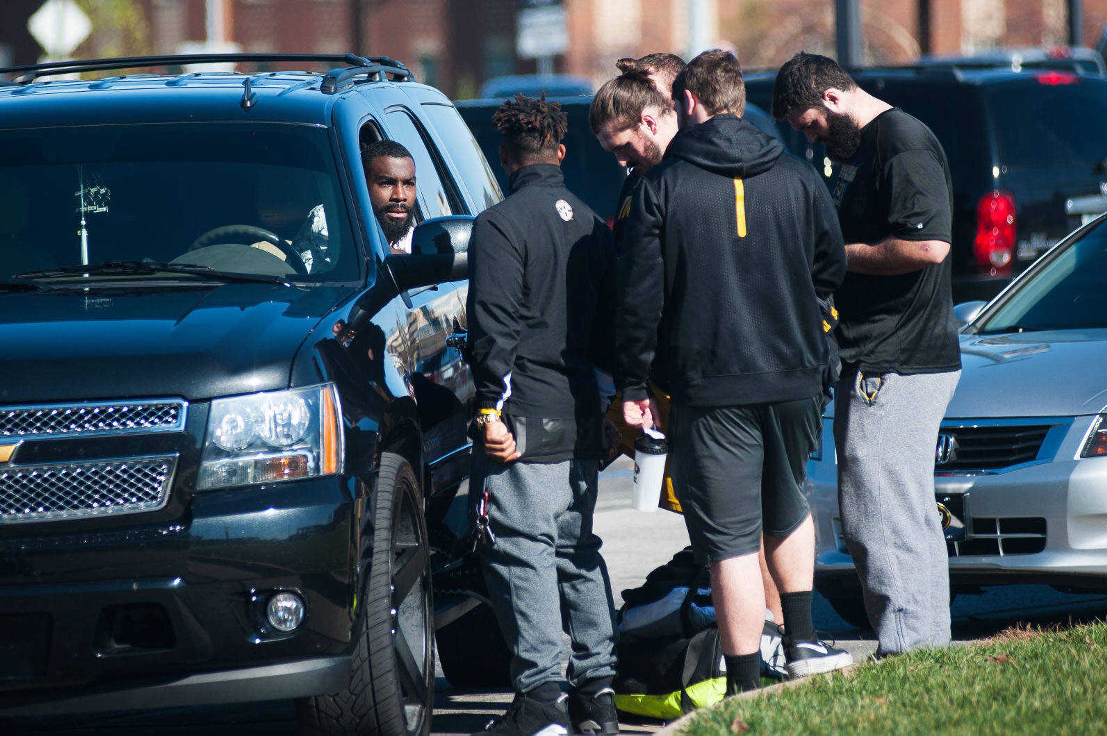 Former Missouri receiver L'Damian Washington, left, speaks Nov. 8 with tailback Russell Hansbrough and other football players outside of the Mizzou Athletics Training Complex in Columbia, Mo. (Nick Schnelle/Columbia Daily Tribune via AP)