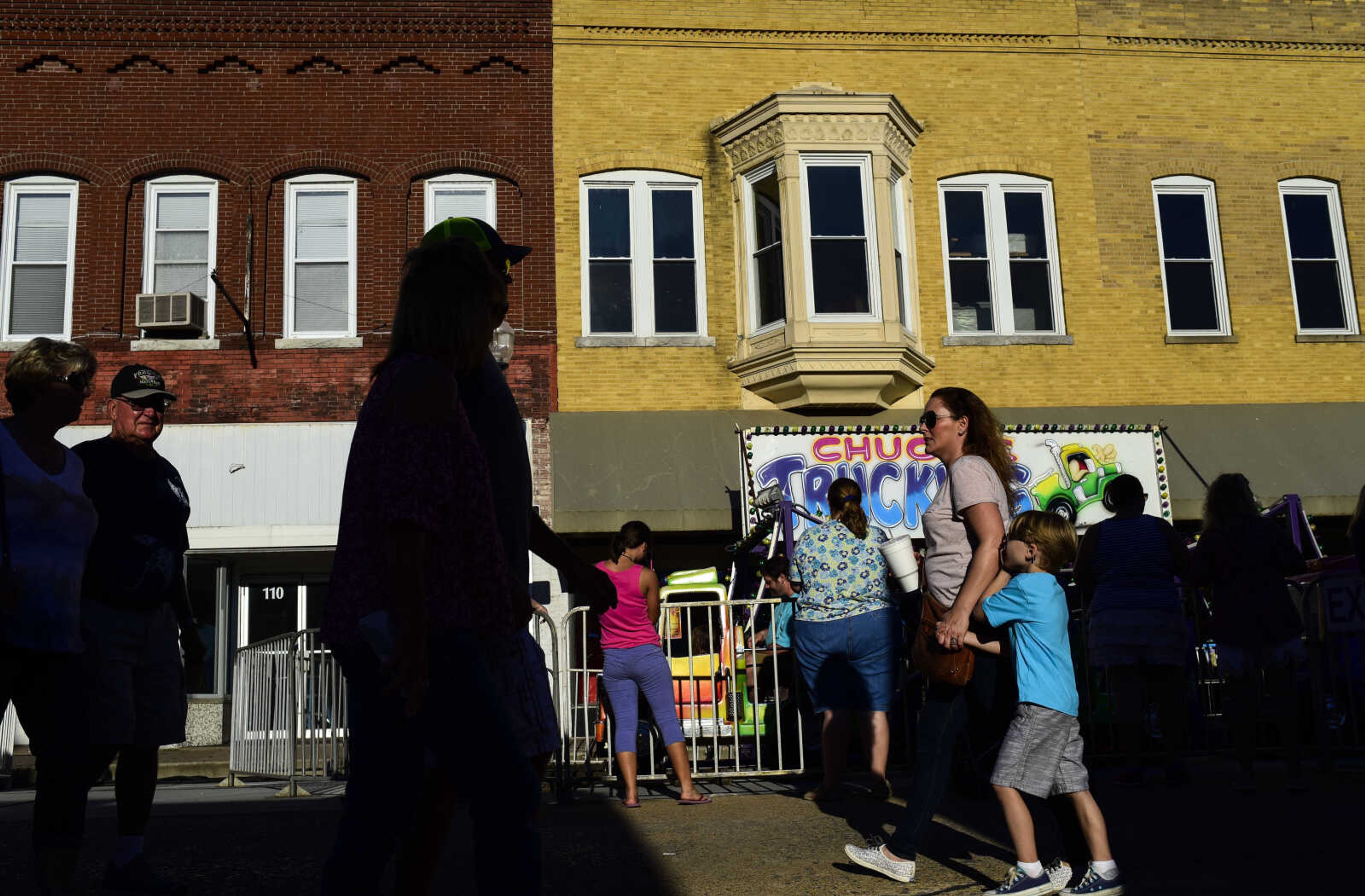 People roam around during the Jackson Homecomers Saturday, July 29, 2017 in Uptown Jackson.