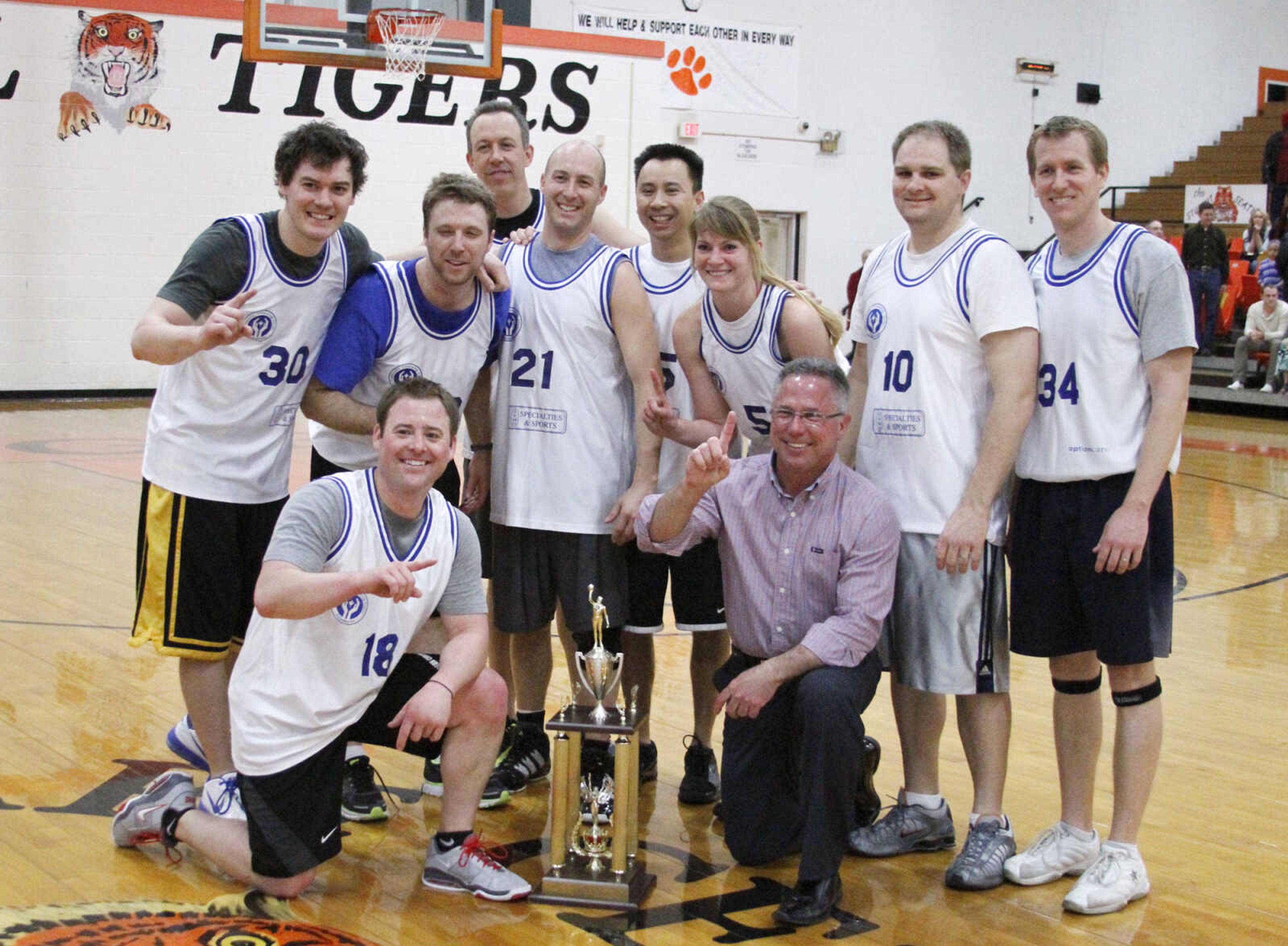 JONATHAN BRIDGES ~ photos@semissourian.com
Doctors pose for a photo after defeating the Lawyers 84-70 Saturday, March 3, 3012 during the 19th annual Doctors vs. Lawyers basketball showdown at Cape Central Junior High School in Cape Girardeau.