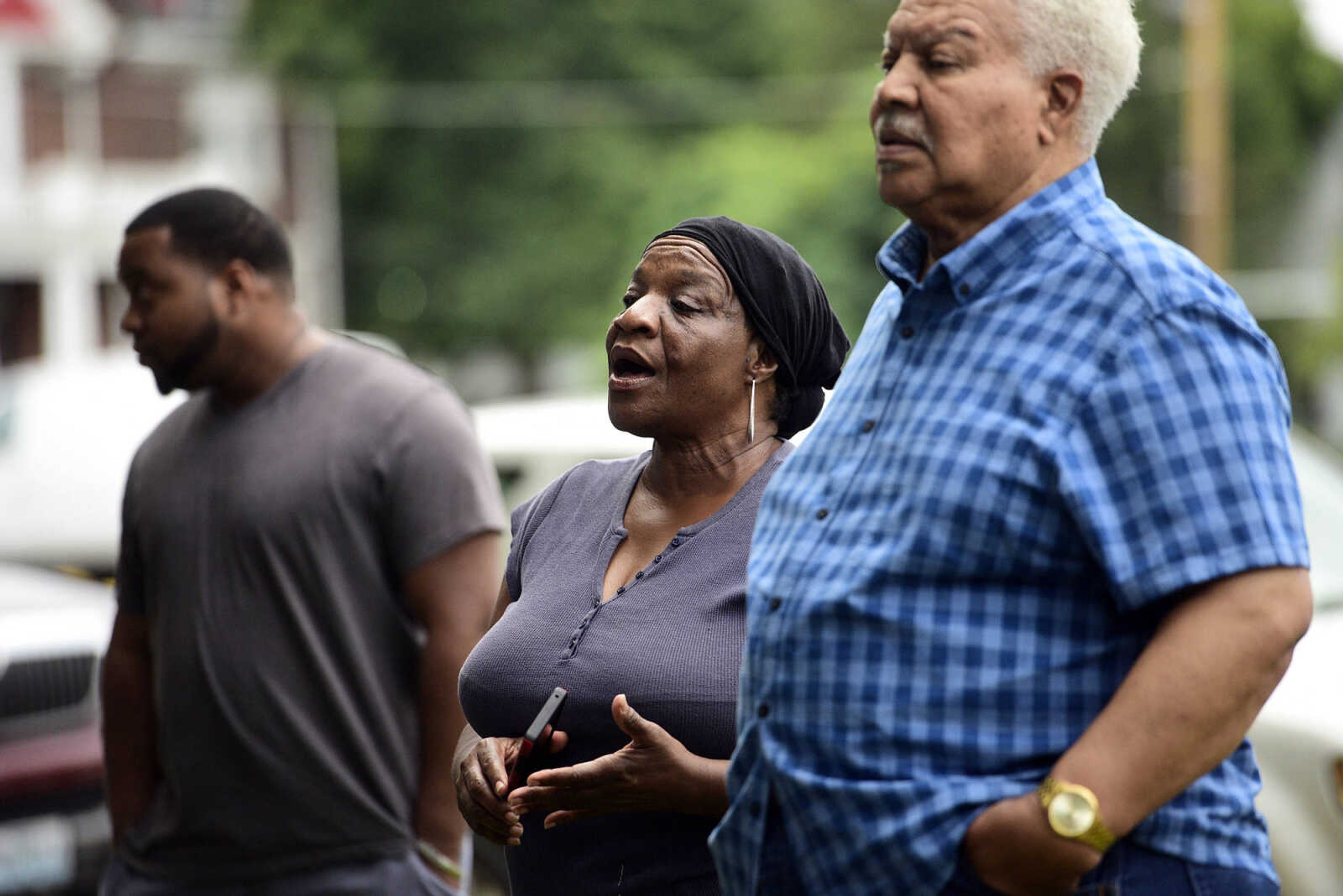 Stafford Moore Jr., left, Shelly Moore, center and Bill Colon sing during the Love, Not Hate rally on Sunday evening, Aug. 13, 2017, at Ivers Square in Cape Girardeau.