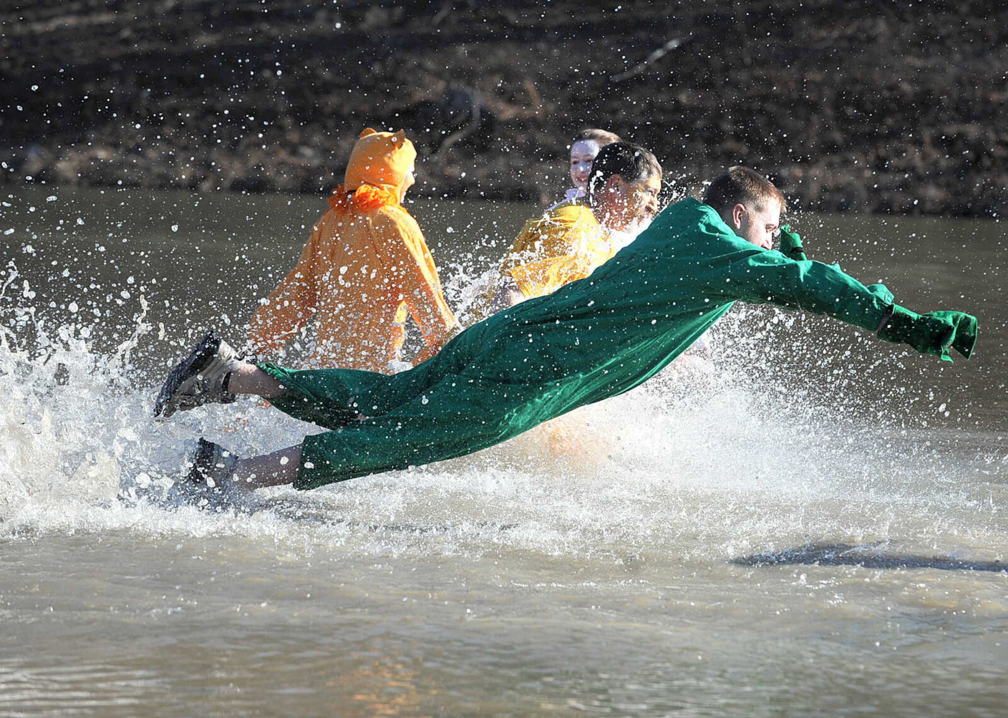 LAURA SIMON ~ lsimon@semissourian.com
People plunge into the cold waters of Lake Boutin Saturday afternoon, Feb. 2, 2013 during the Polar Plunge at Trail of Tears State Park. Thirty-six teams totaling 291 people took the annual plunge that benefits Special Olympics Missouri.