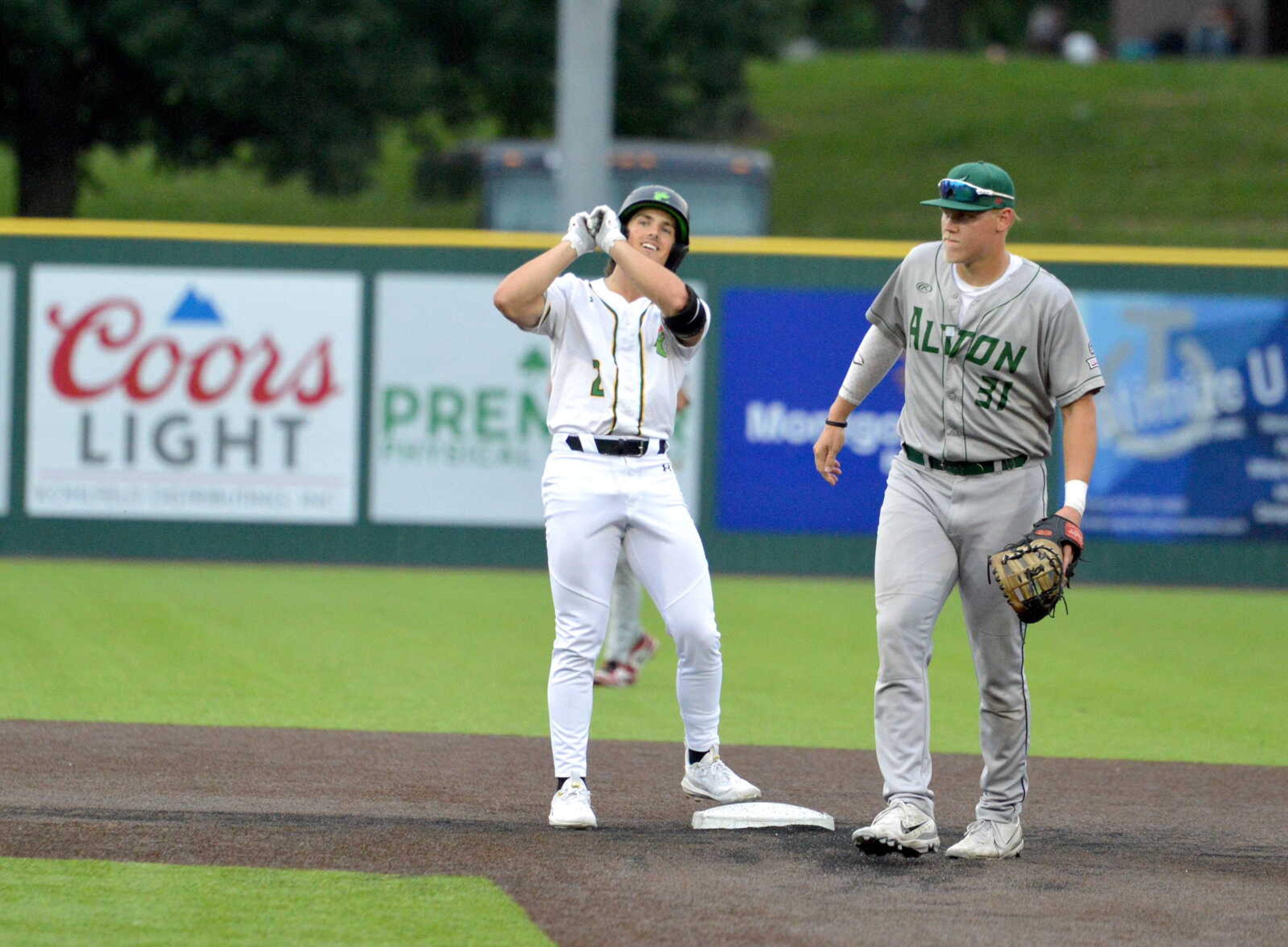 Cape Catfish outfielder Steven Schneider celebrates hitting a double against the Alton River Dragons on Tuesday, June 18, at Capaha Field. 