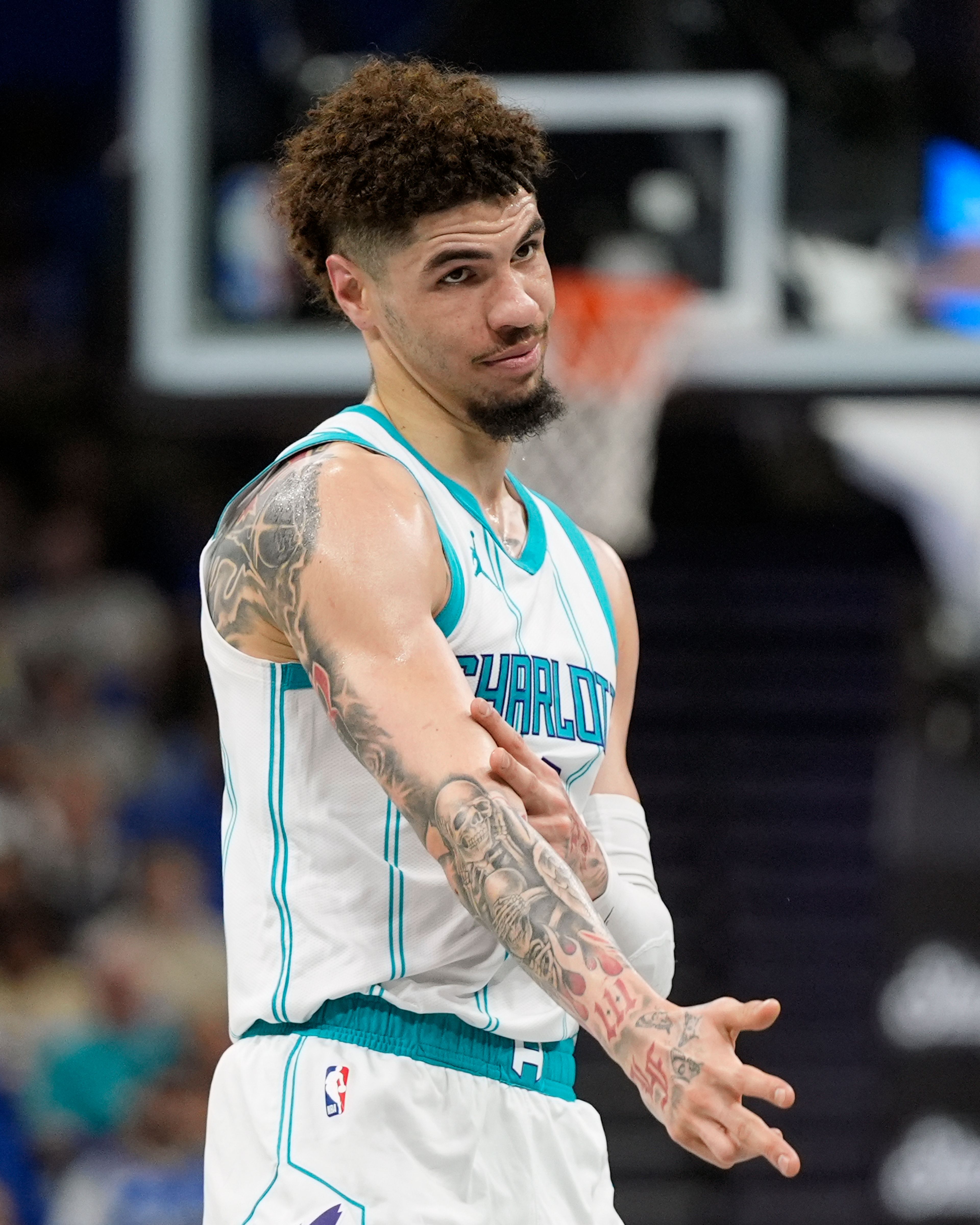 Charlotte Hornets guard LaMelo Ball gestures after making a 3-point shot against the Orlando Magic during the first half of an Emirates NBA Cup basketball game, Tuesday, Nov. 12, 2024, in Orlando, Fla. (AP Photo/John Raoux)