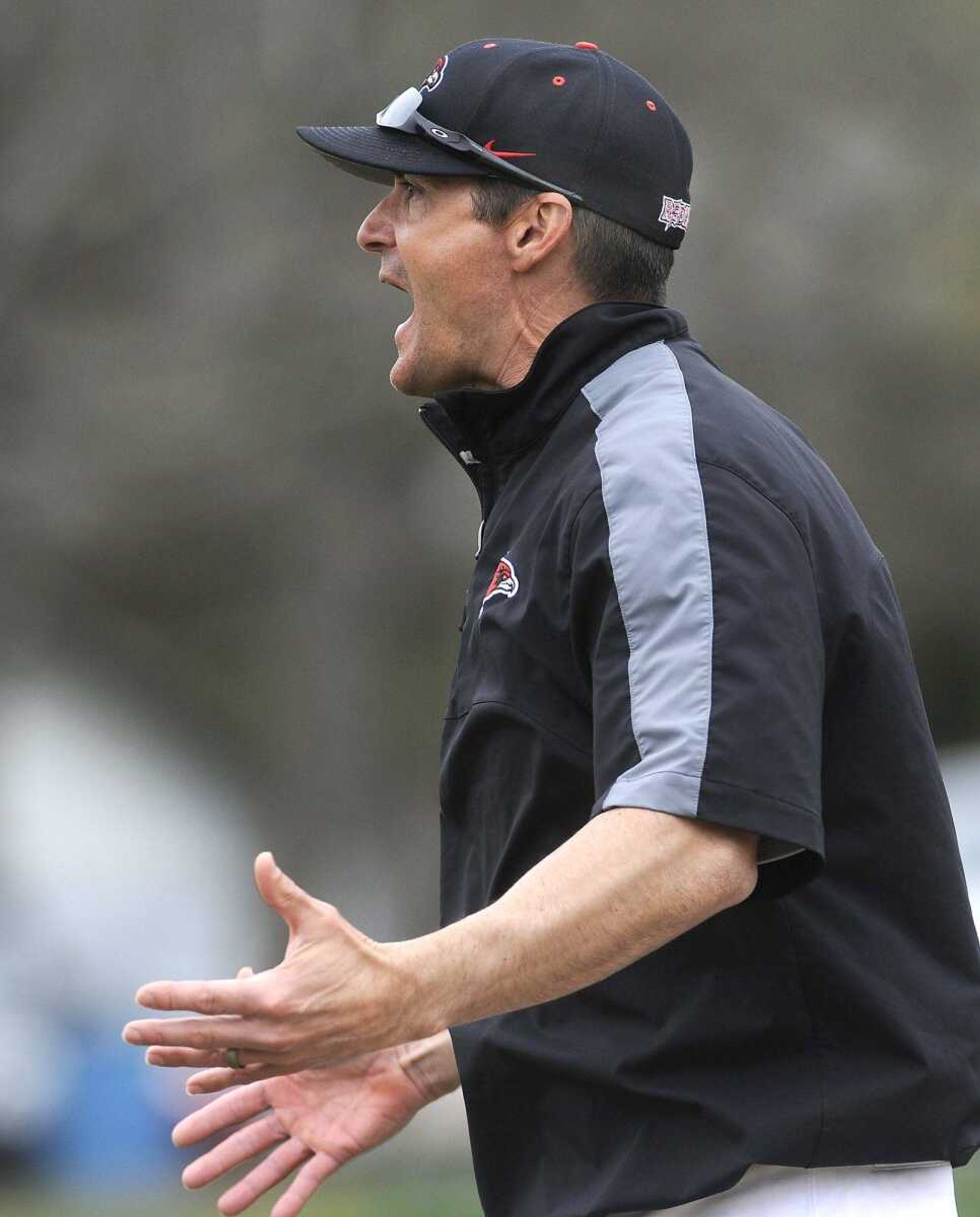 Southeast Missouri State coach Steve Bieser walks out to the third-base umpire to discuss a call after Clayton Evans grounded out to third base during the sixth inning Sunday, April 5, 2015 at Capaha Field. (Fred Lynch)