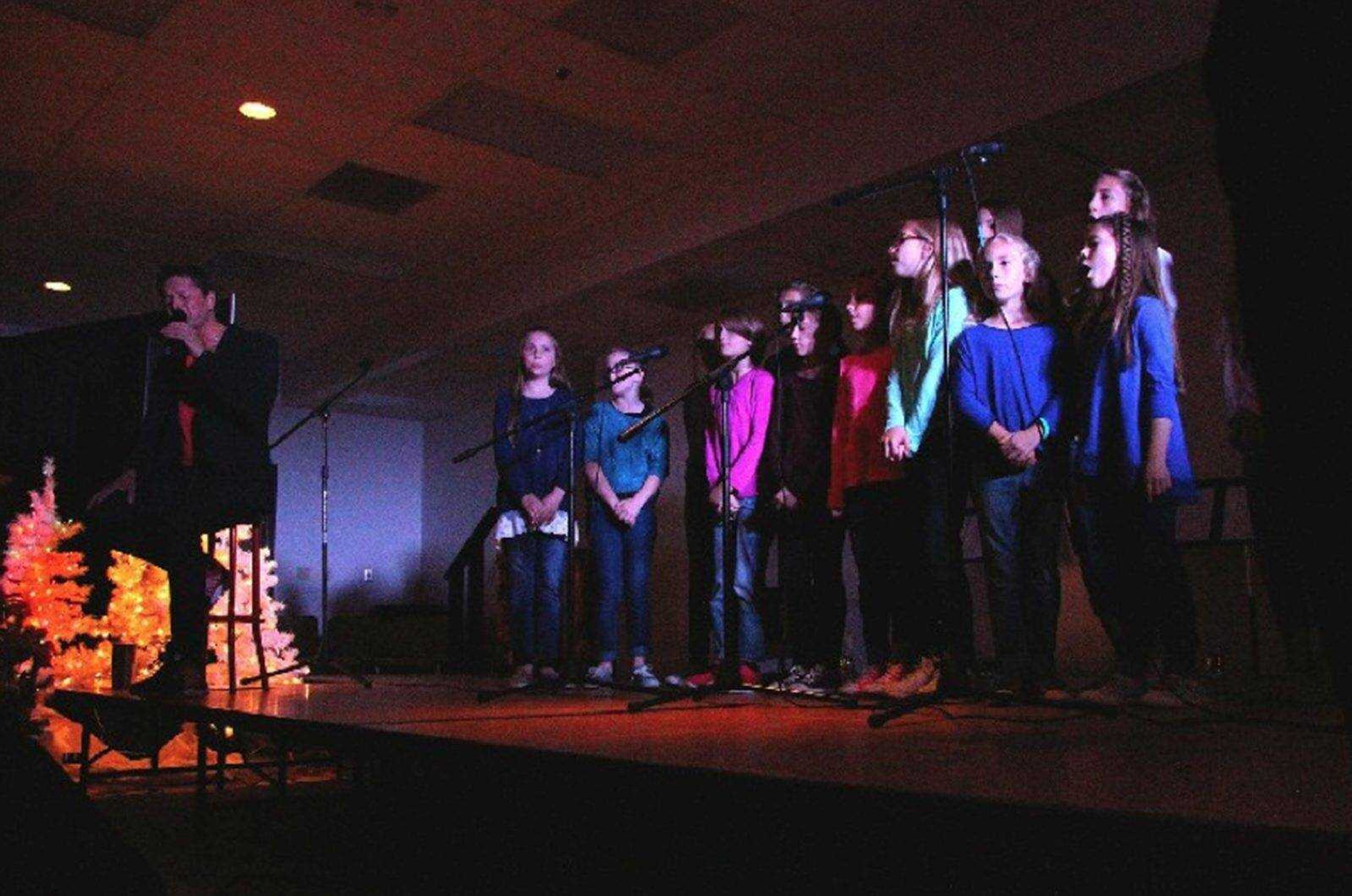 Singer Steph Carse and the Immaculate Conception School Choristers sing Leonard Cohen's "Hallelujah" during an anti-bullying benefit concert Sunday at the Osage Centre.