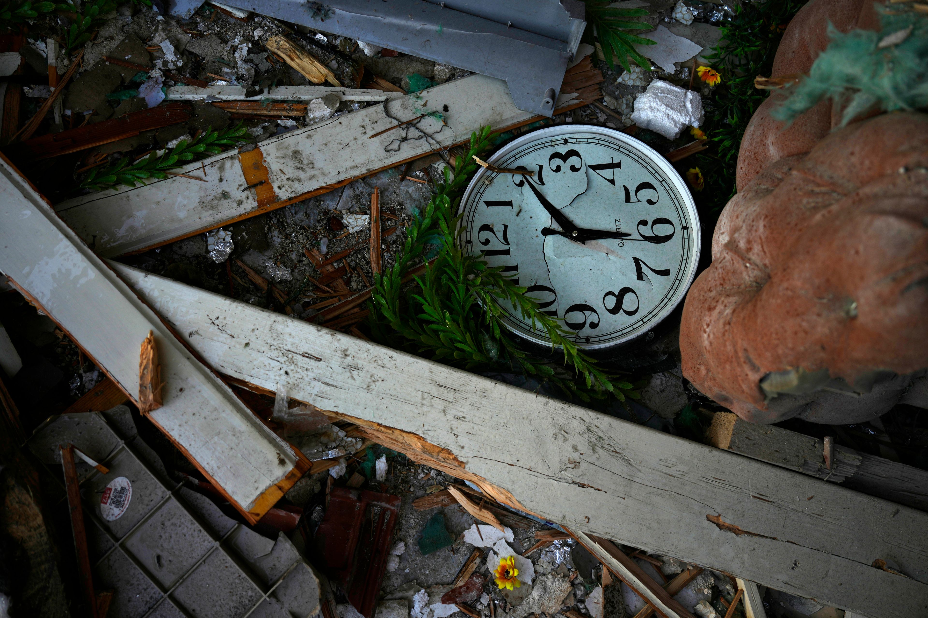 Damage to a home struck by a rocket fired from Lebanon in the town of Majd al-Krum , northern Israel, Wednesday, Oct. 16, 2024. (AP Photo/Ariel Schalit)