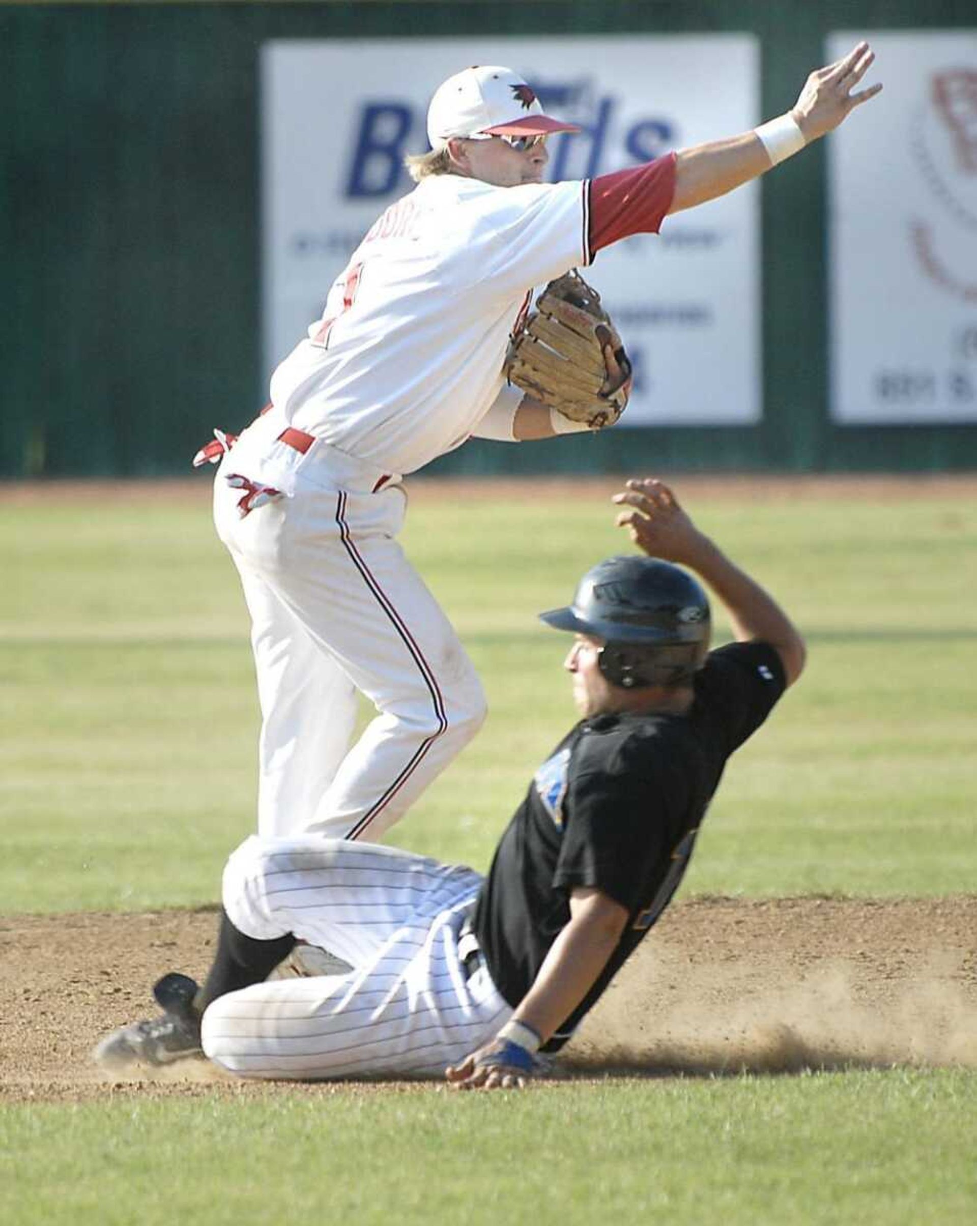 Redhawks shortstop Robby Moore completes a double play over Morehead's Christian Winstanley during game 2 at Capaha Park on Saturday, May 12, 2007. (Kit Doyle)