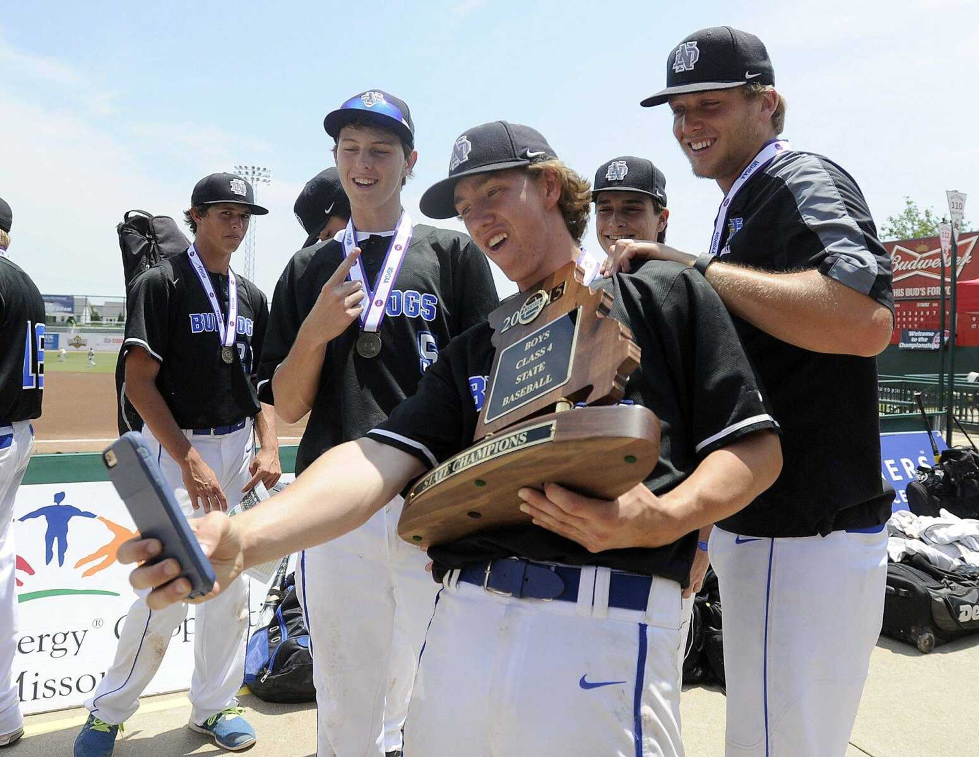 Notre Dame players take a selfie with their Class 4 championship trophy, Saturday, June 6, 2015, in O Fallon, Missouri. Notre Dame defeated Sullivan 17-0 in five innings. (Laura Simon)