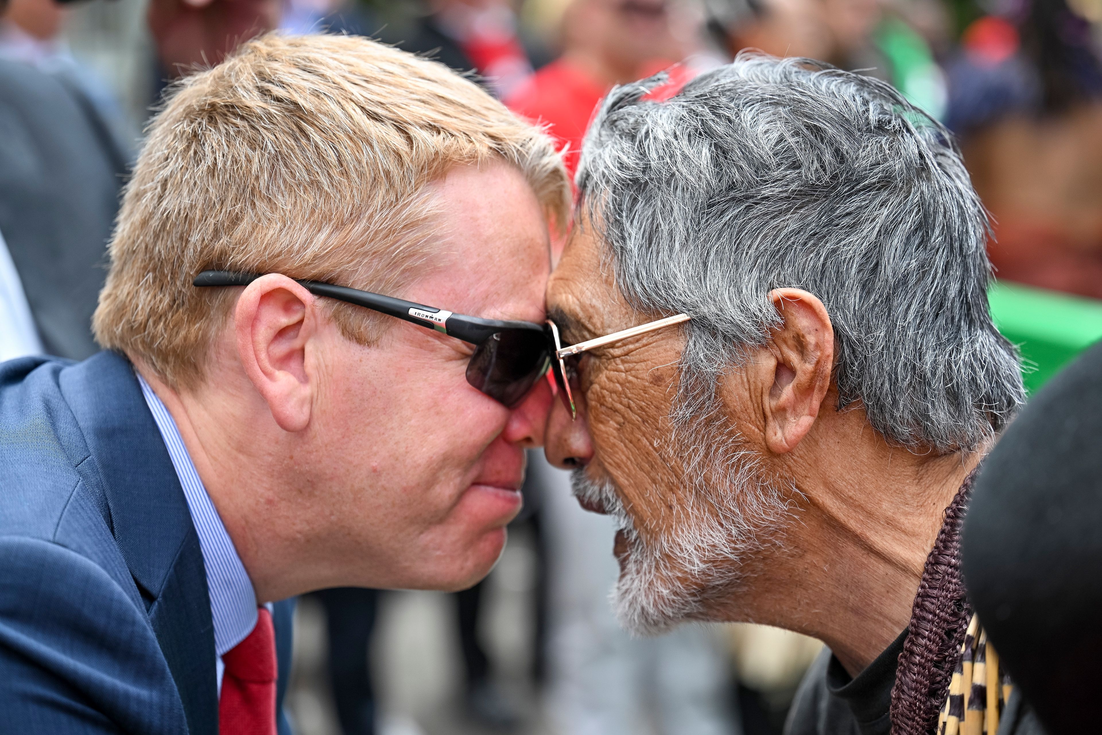 New Zealand's opposition leader Chris Hipkins, left, does a hongi with Hare Arapere as people gathered outside New Zealand's parliament to protest a proposed law that would redefine the country's founding agreement between Indigenous Māori and the British Crown, in Wellington Tuesday, Nov. 19, 2024. (AP Photo/Mark Tantrum)