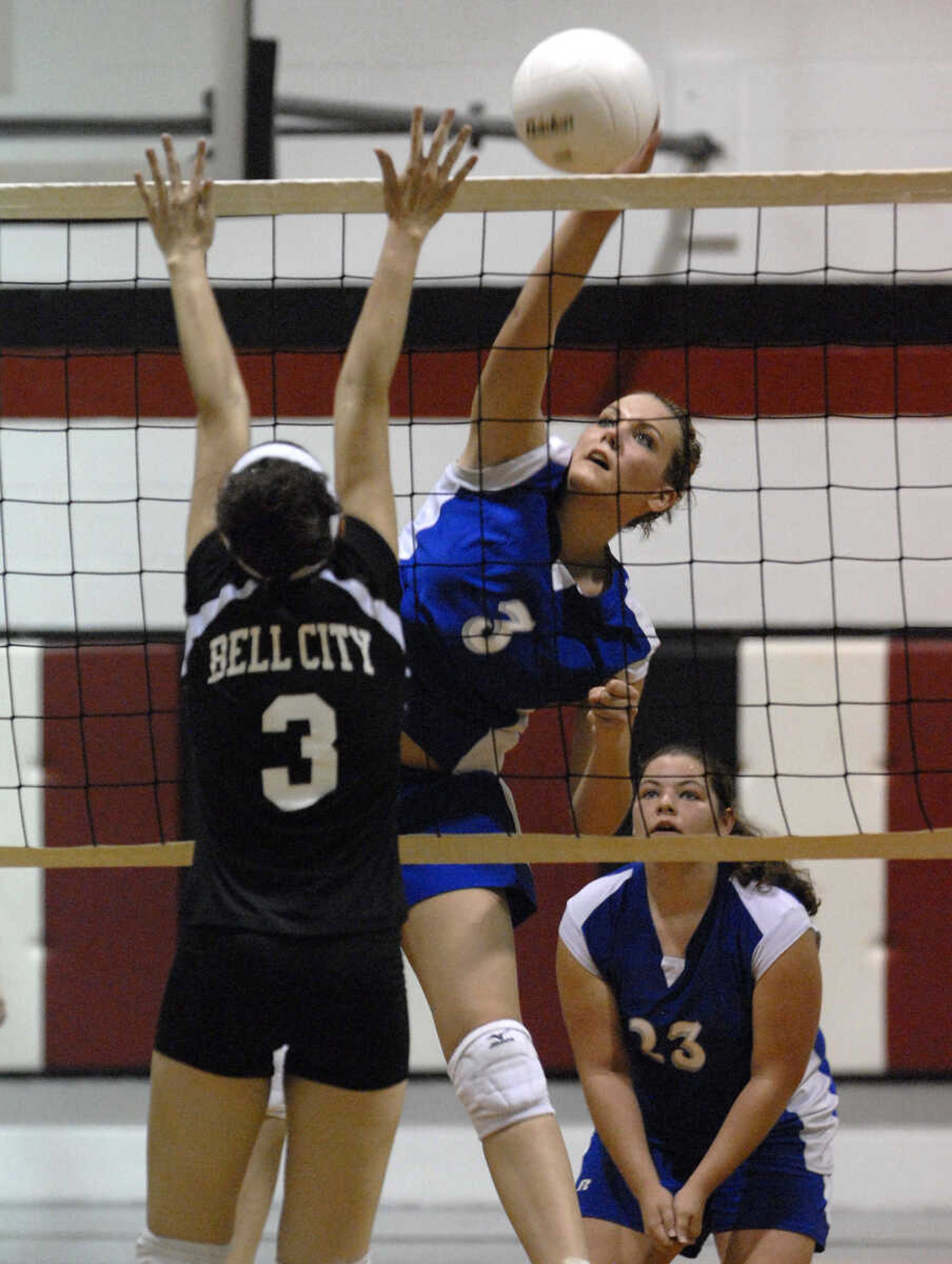 FRED LYNCH ~ flynch@semissourian.com
Leopold's Kirsten Thele spikes over Bell City's Ashley Green during the fourth game Friday at Bell City.