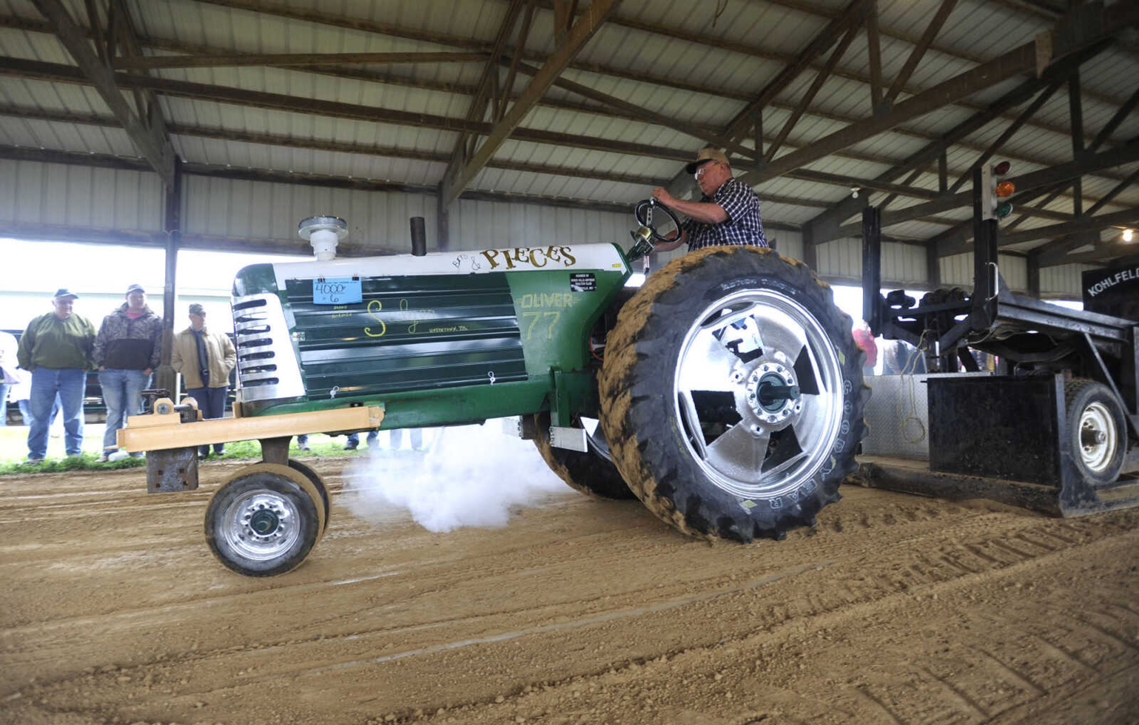 Donald Salger of Perryville, Missouri drives his Oliver 77 in the tractor pull at the Cousin Carl Farm Show on Saturday, March 12, 2016 at Arena Park.