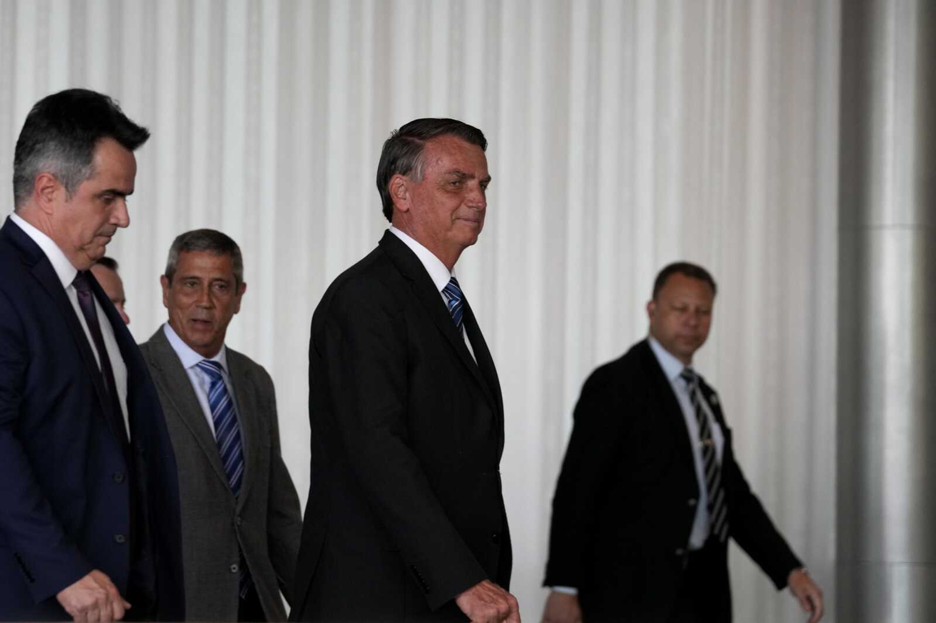 Brazilian President Jair Bolsonaro arrives to speak from his official residence of Alvorada Palace in Brasilia, Brazil, Tuesday, Nov. 1, 2022, the leader's first public comments since losing the Oct. 30 presidential runoff. (AP Photo/Eraldo Peres)