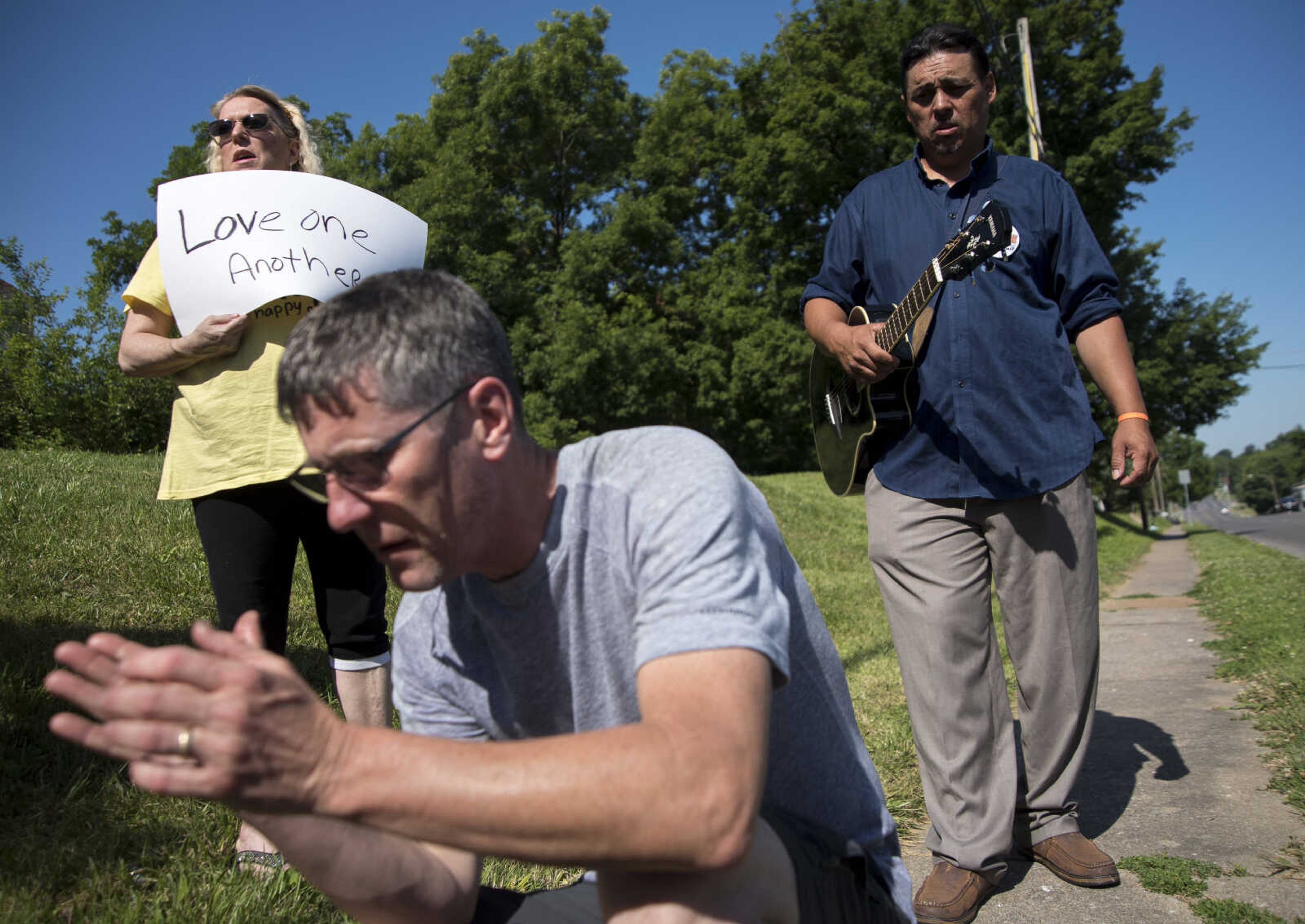 Community members pray during a Stop Needless Acts of Violence Please (SNAP) prayer march Saturday, June 10, 2017 in Cape Girardeau.