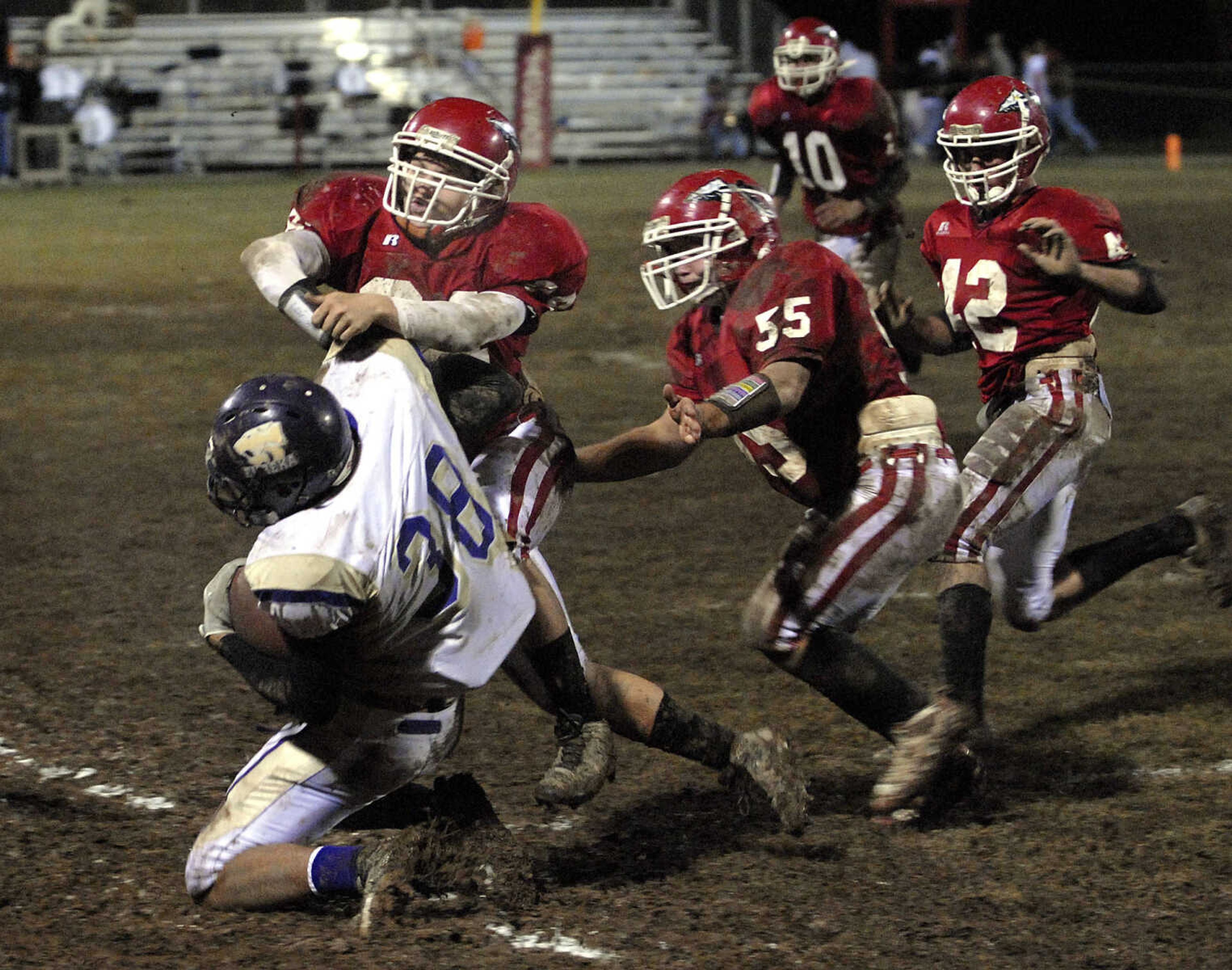 FRED LYNCH ~ flynch@semissourian.com
Eureka's Aaron Schnurbusch is pushed out of bounds by Jackson defenders Dylan Stone and Michael Riney during the third quarter Friday at Jackson.