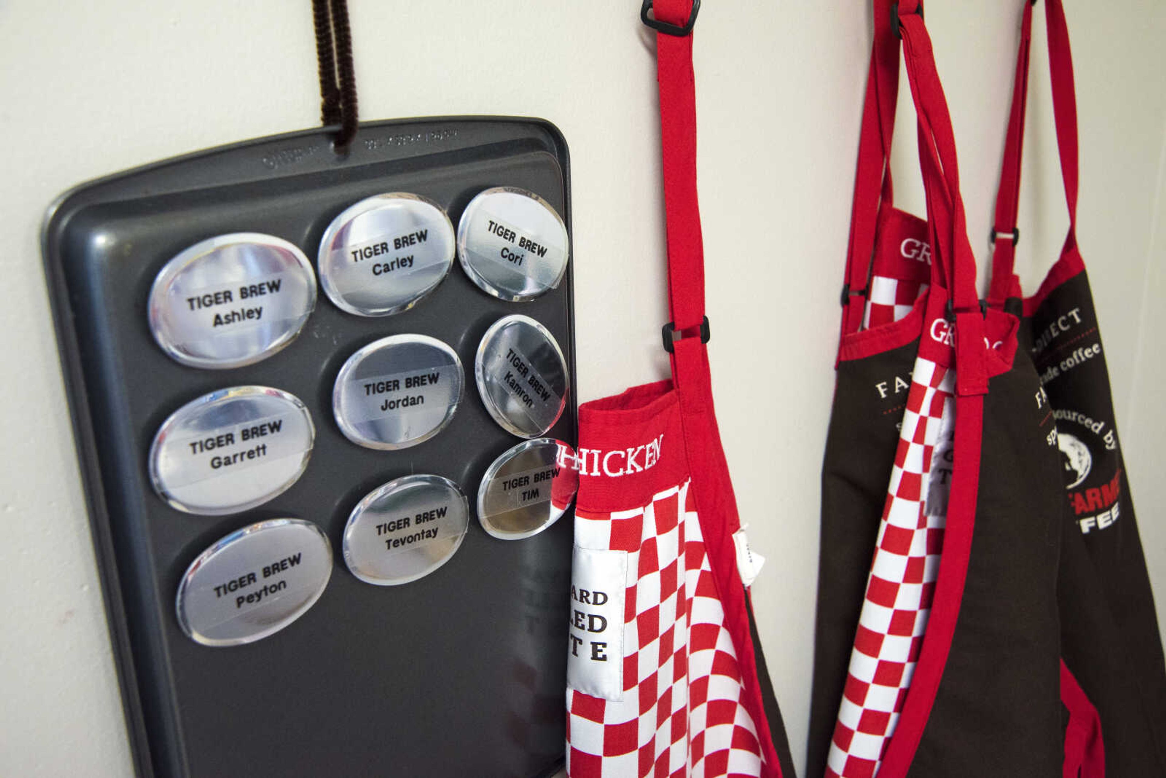 ANDREW J. WHITAKER ~ awhitaker@semissourian.com
Aprons and name tags hang on the wall for Tiger Brew, a student run business run by the special education department at Cape Girardeau Central, Tuesday, Dec. 13, 2016 in Cape Girardeau. Tiger Brew is available Monday through Friday during three different class periods, 1st hour, 2nd hour and advisory and offer a variety of drinks from hot coffees and teas, iced drinks, hot chocolates and even smoothies.