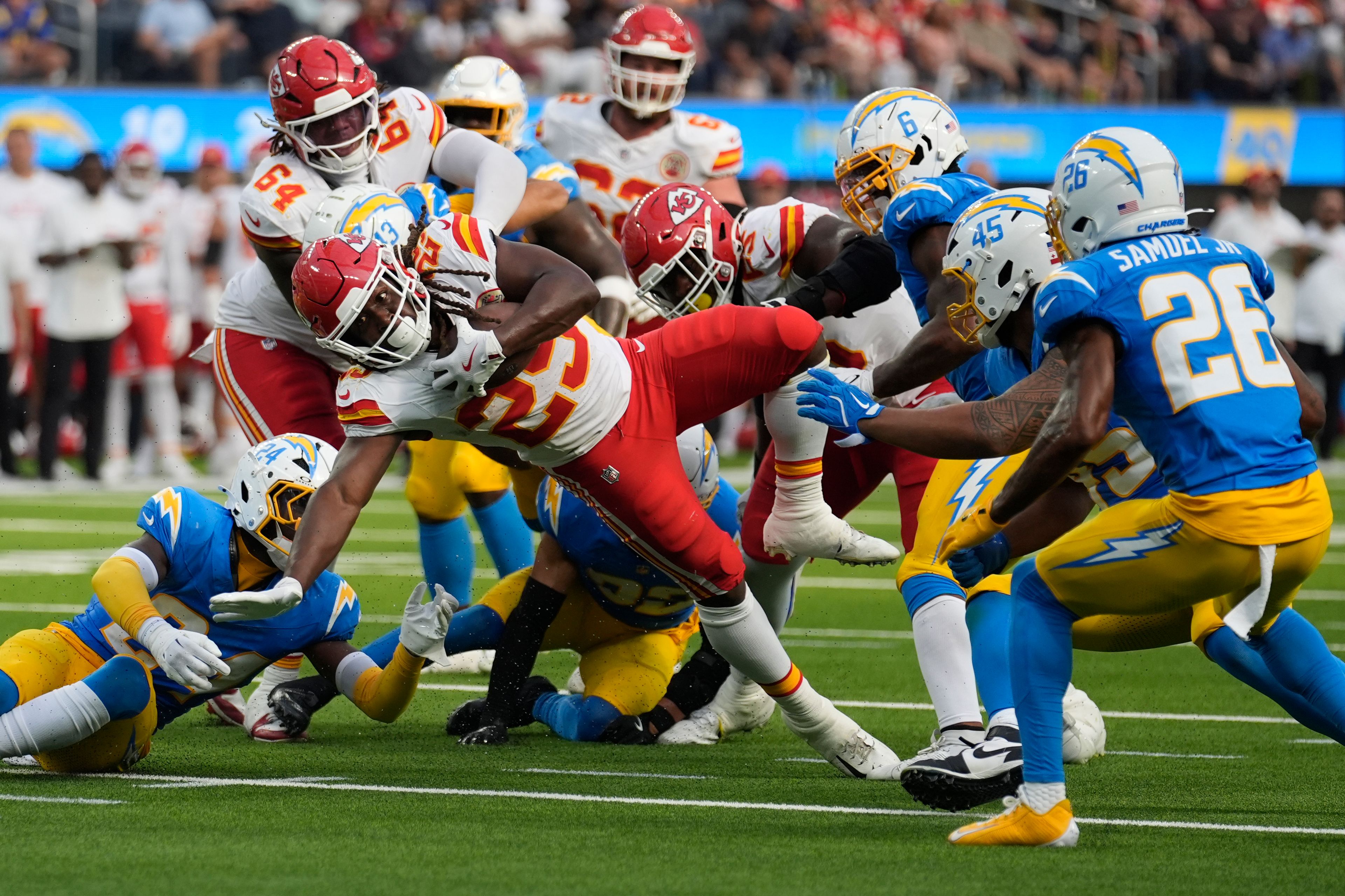 Kansas City Chiefs running back Kareem Hunt (29) struggles for yardage during the second half of an NFL football game against the Los Angeles Chargers Sunday, Sept. 29, 2024, in Inglewood, Calif. (AP Photo/Marcio Jose Sanchez)