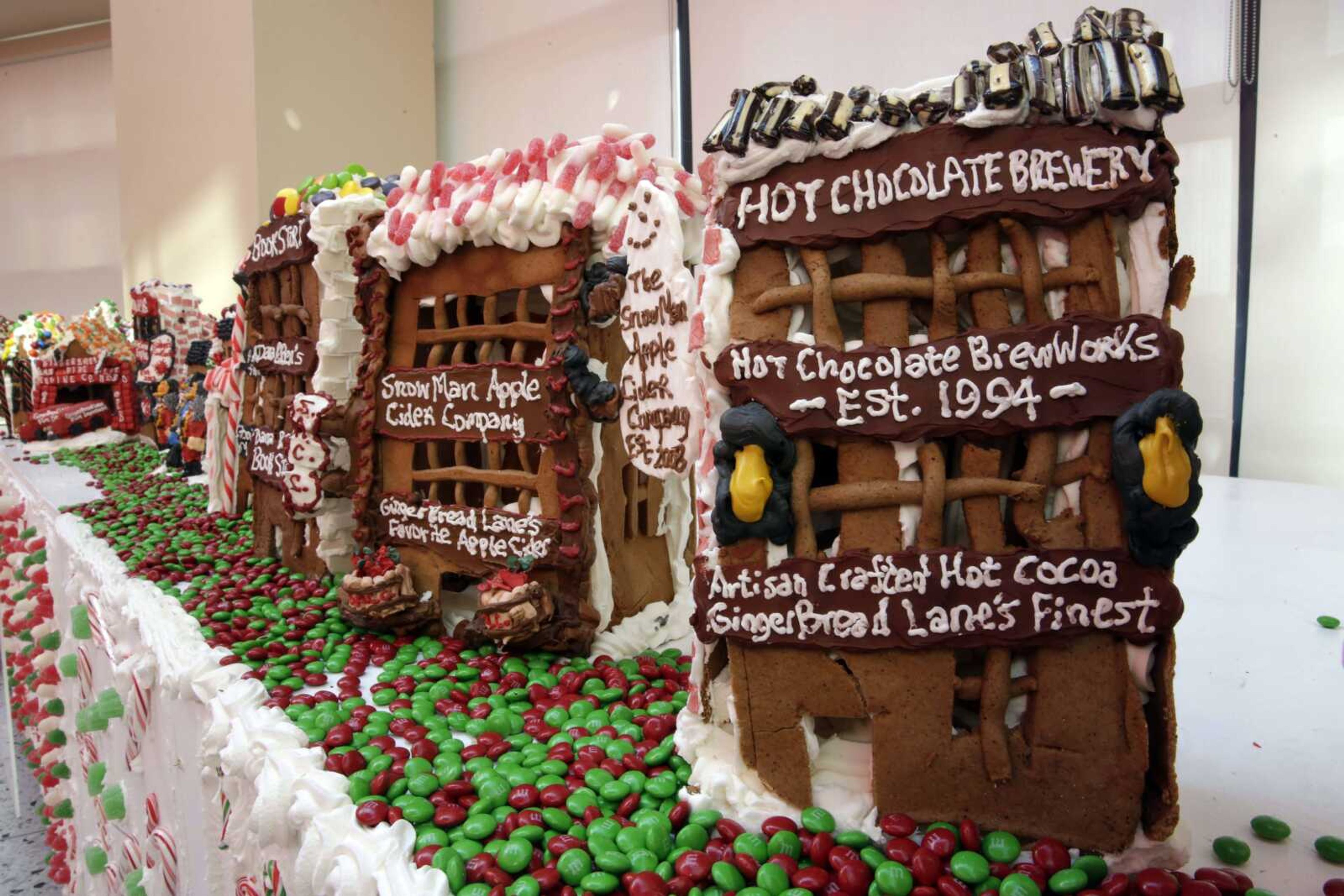 Some of the gingerbread house creations by Chef Jon Lovitch are displayed in his GingerBread Lane, at the New York Hall of Science, in the Queens borough of New York, Thursday. Lovitch, a Manhattan chef who holds the Guinness record for creating the world's largest collection of gingerbread houses, is now going for another record, competing against himself by assembling more than 1,000 new ones. (Richard Drew ~ AP Photo)