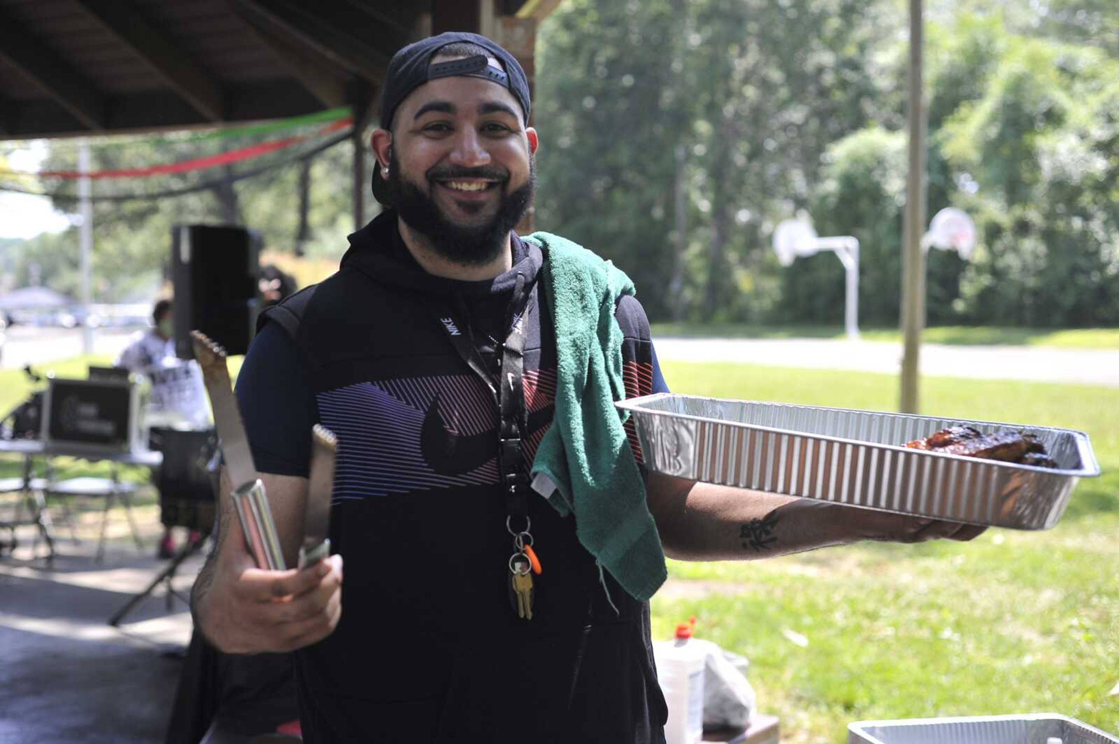 Anthony Green shows off barbecued chicken at a Juneteenth celebration Friday, June 19, 2020, at Arena Park in Cape Girardeau.