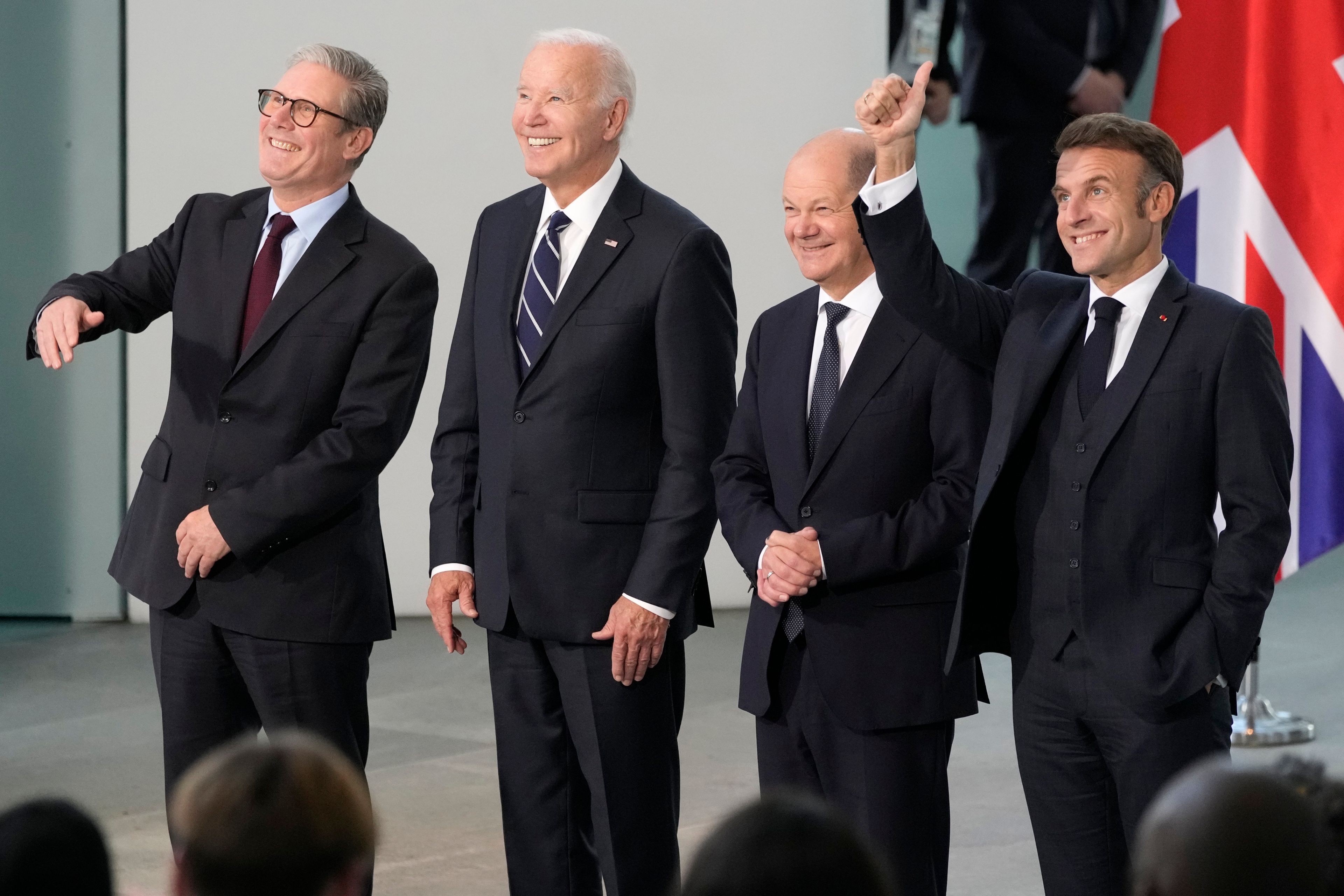 President Joe Biden, 2nd left, Chancellor Olaf Scholz of Germany, 2nd right, President Emmanuel Macron of France, right, and Prime Minister Keir Starmer of the United Kingdom, smile as they meet at the Chancellery in Berlin, Germany, Friday, Oct. 18, 2024. (AP Photo/Ben Curtis)