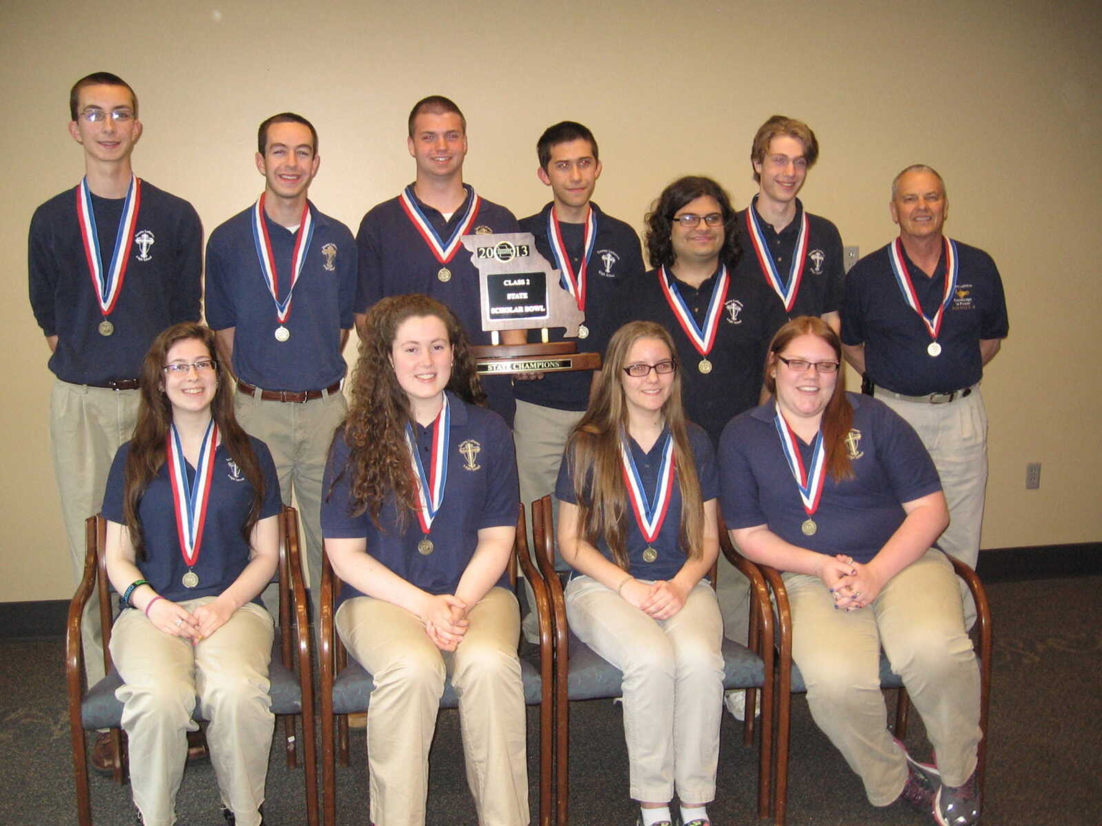 Saxony Scholar Bowl Team -- Seated: Sarah Willis, Lauren Barr, Elizabeth Miesner, and Cori Butler. Standing: Josh Vogel, Zach Vogel, A J Garms, Joey Deiermann, Benji Dordoni, Ben Spiecker, and Coach Verlin Mangels.