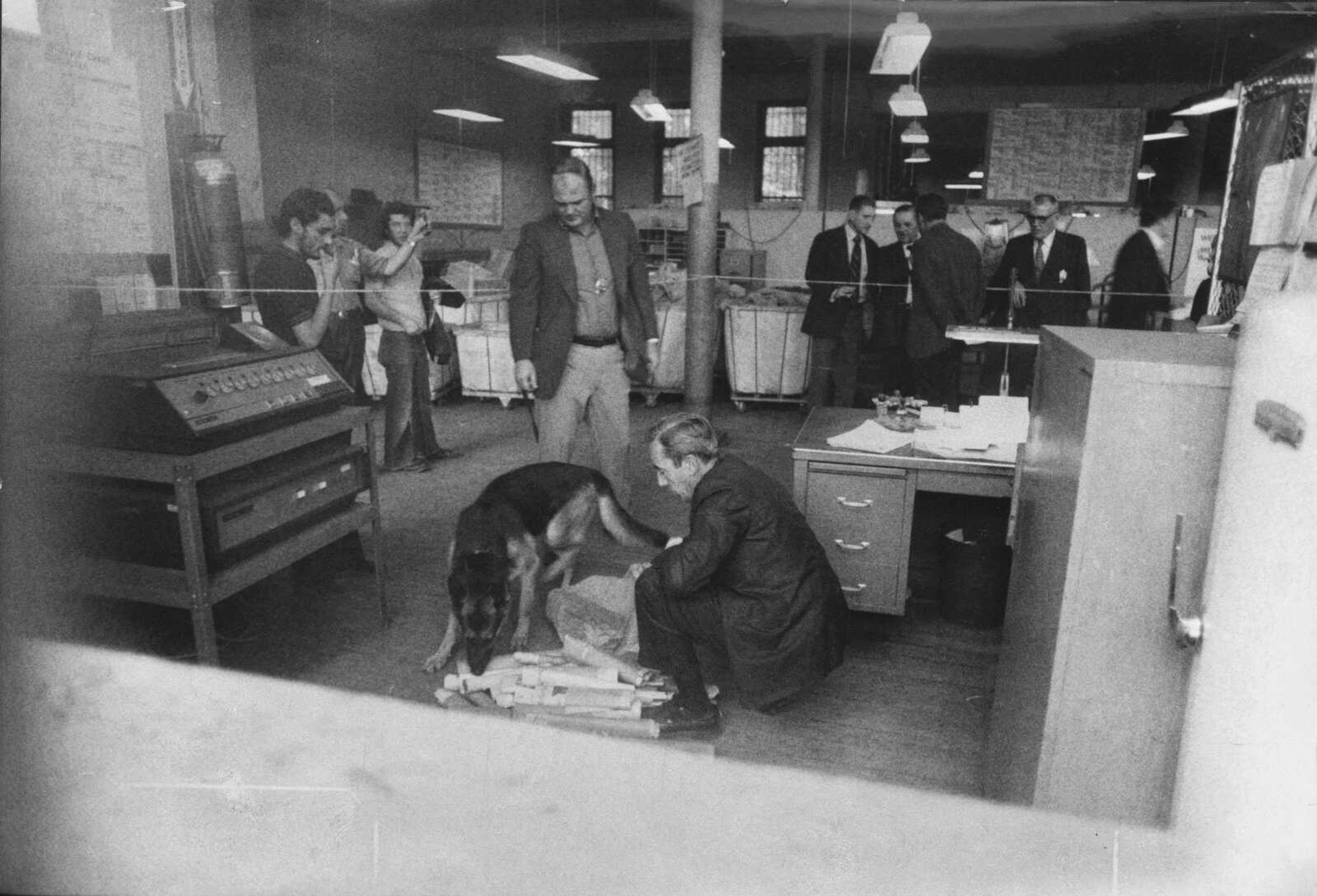 LEE ROMERO ~ The New York Times, file<br>A police dog sniffs mail for explosives at the post office at 420 E. 189th St. in the Bronx borough of New York City in this photo published Oct. 15, 1972, in The New York Times. Federal documents linked the explosives used in a letter bomb that exploded at the post office to an attempted attack by Khalid Duhham Al-Jawary on Israeli targets in 1973. Postal worker William Figueroa was injured in the blast at the post office.