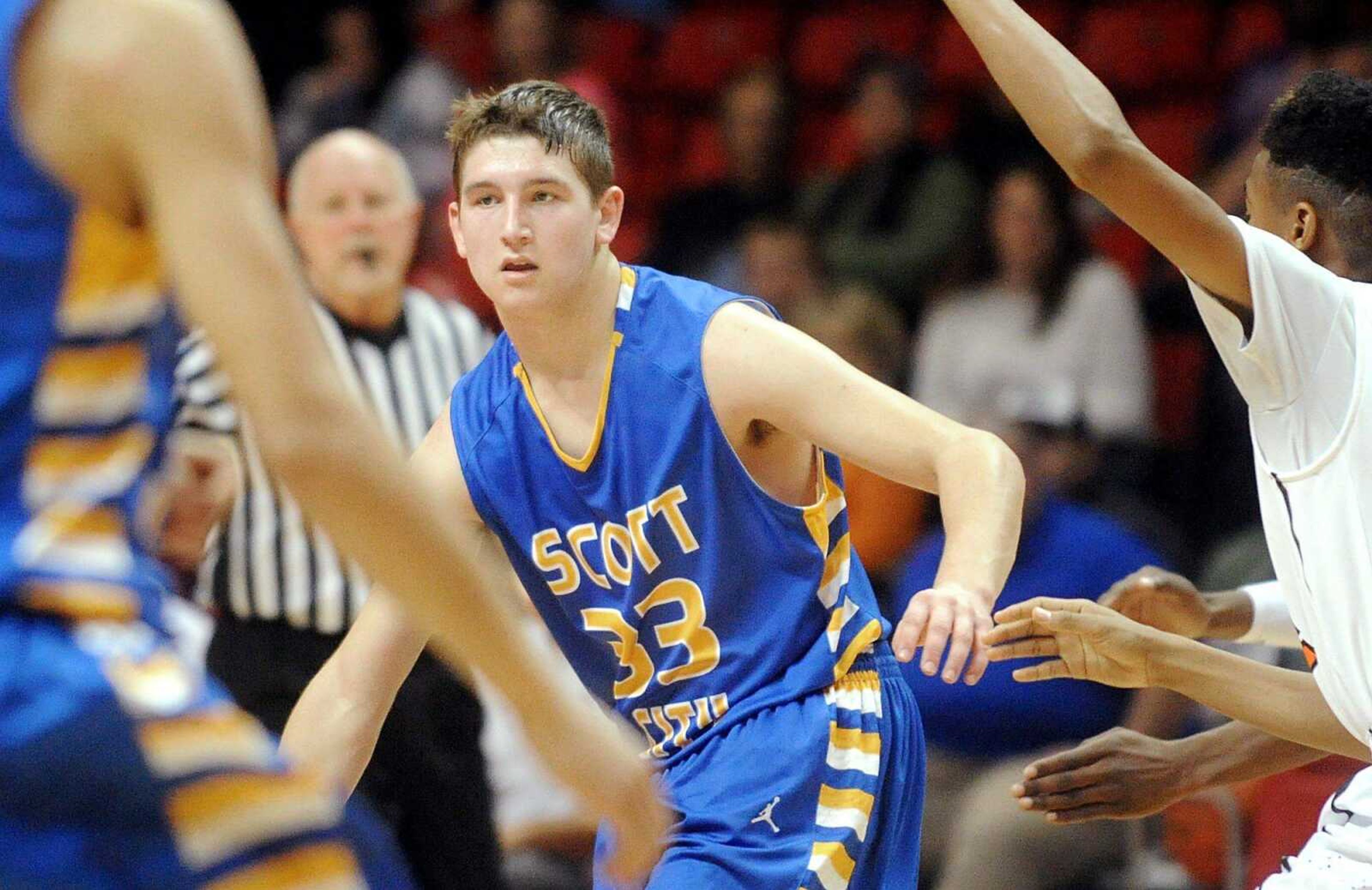 Scott City&#8217;s Dominic Hooper maneuvers around Scott County Central players during the first round Dec. 26 of the Southeast Missourian Christmas Tournament at the Show Me Center. Hooper died after an ATV accident weeks later, and many of his organs were donated. (Laura Simon)