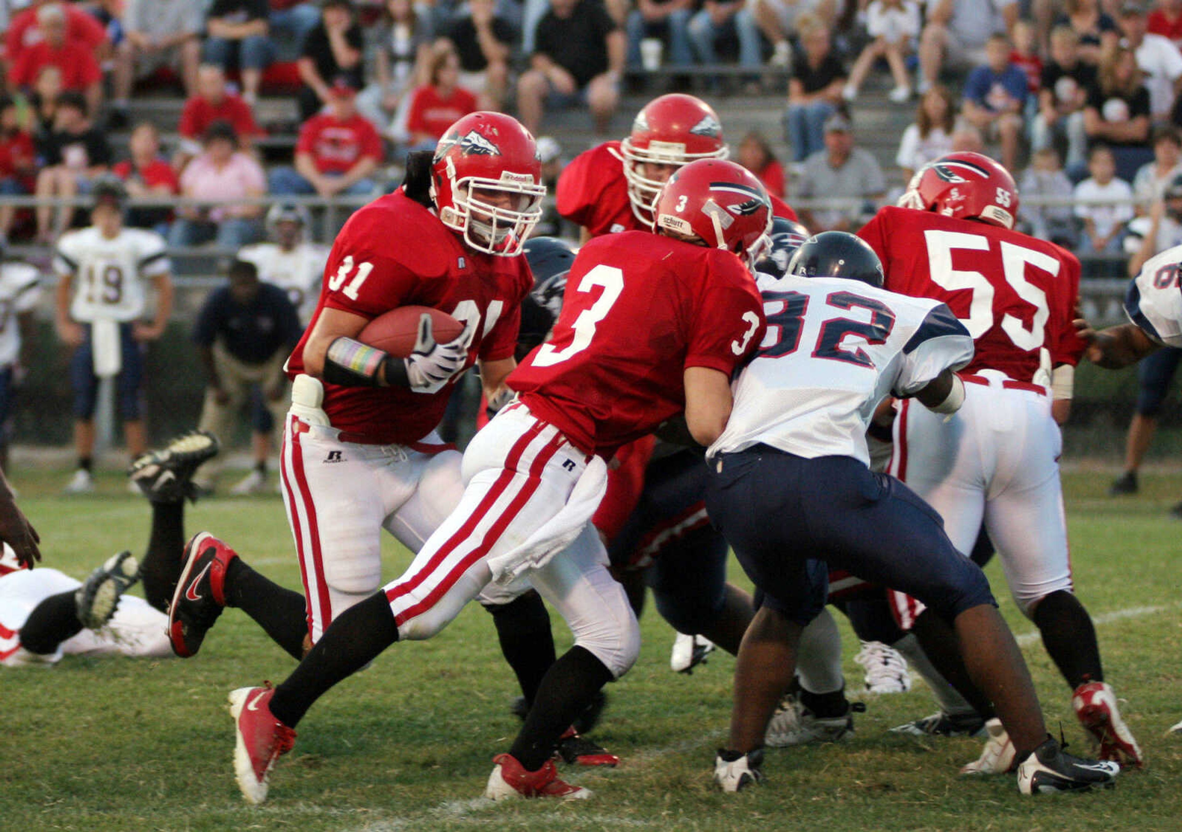 SEAN MAGEE ~ photos@semissourian.com
Jackson's Cole Rodgers pushes through for a first down against Parkway South with help from Ethan Ruch (3) Friday at Jackson.