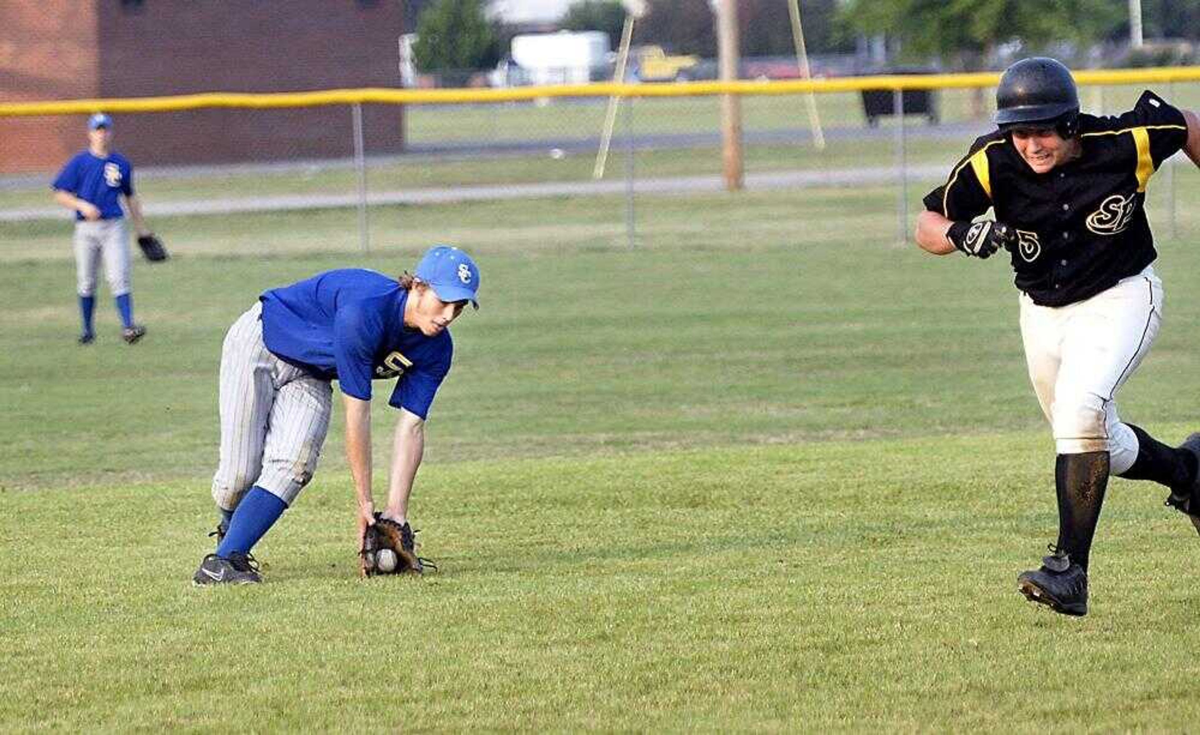 Scott City shortstop Josh Henson fielded a grounder as South Pemiscot's Aaron Booker advanced to third during their sectional game Wednesday in Steele, Mo. (Kit Doyle)