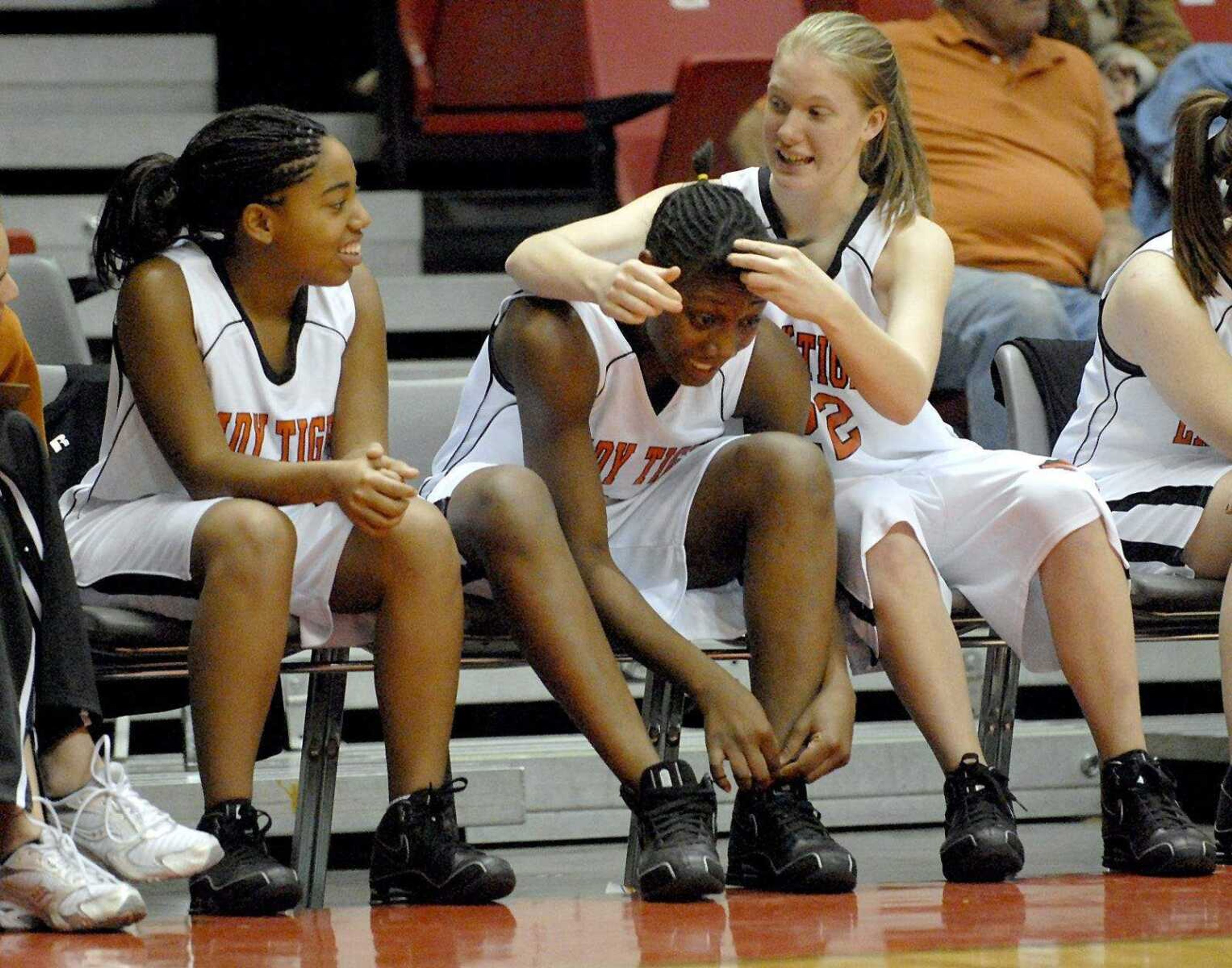 ELIZABETH DODD ~ edodd@semissourian.com
Central's Crystal Vinson, left, Paige Smith, and Amy Kinnison relax with the game well in hand with two minutes left against Perryville during the Holiday Classic on Tuesday ending in a Central victory 72-59.