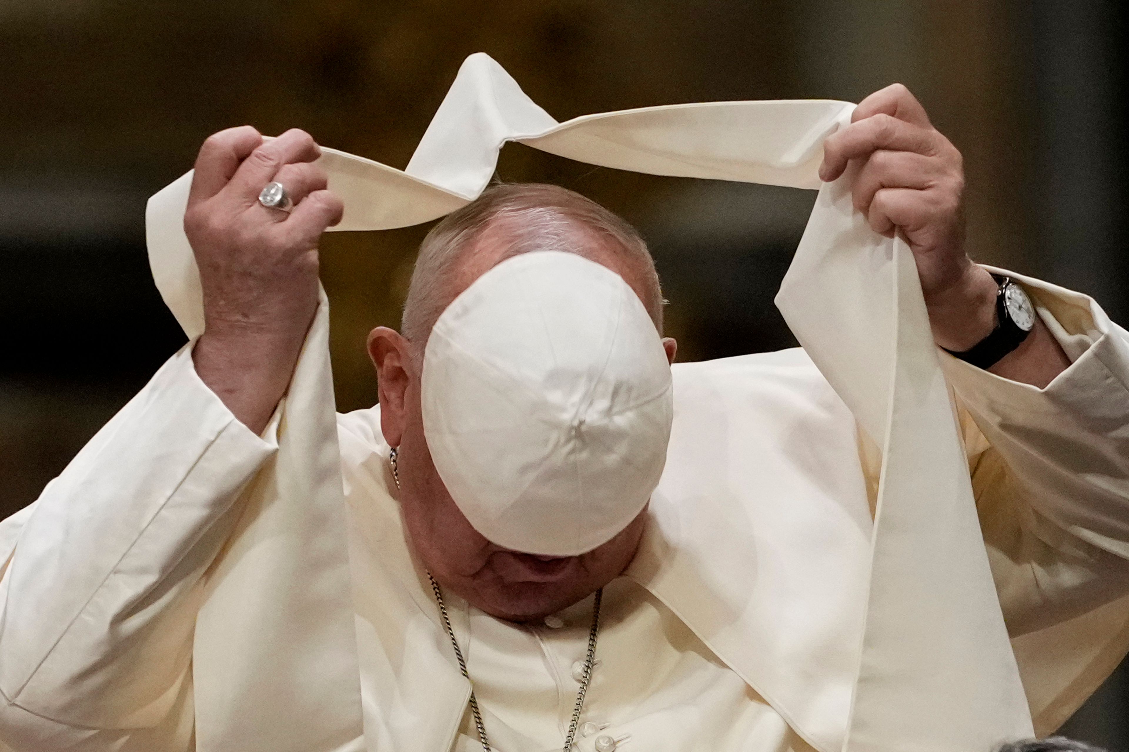 Pope Francis loses his scull cap during a meeting with diocesan community in the Basilica of St. John Lateran, in Rome, Friday, Oct. 25, 2024. (AP Photo/Alessandra Tarantino)