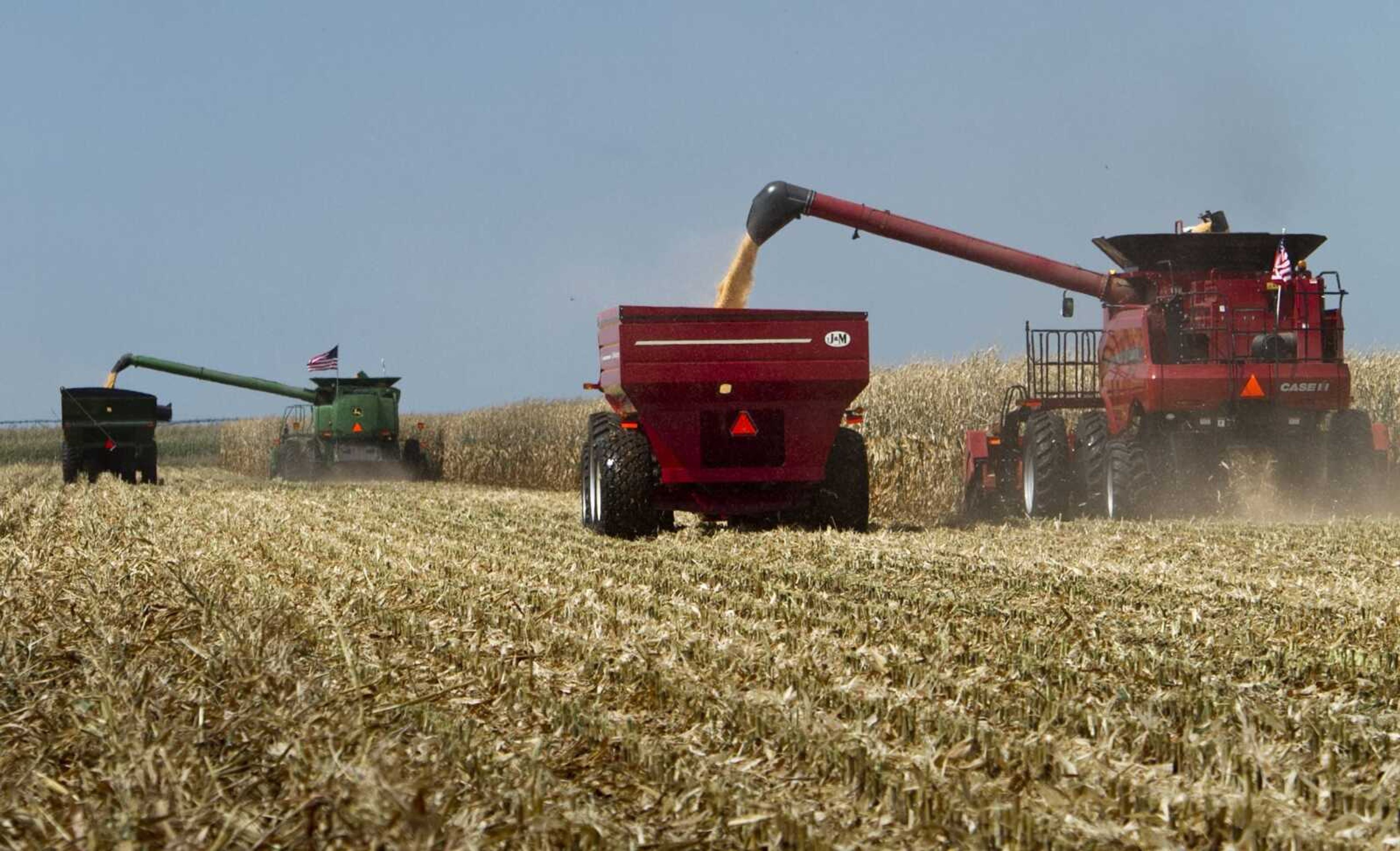 FILE - In this Sept. 15, 2010, file photo, combines, costing several hundred thousand dollars each, harvest a field during a corn harvesting demonstration at the Husker Harvest Days fair, in Grand Island, Neb. (AP Photo/Nati Harnik, File)