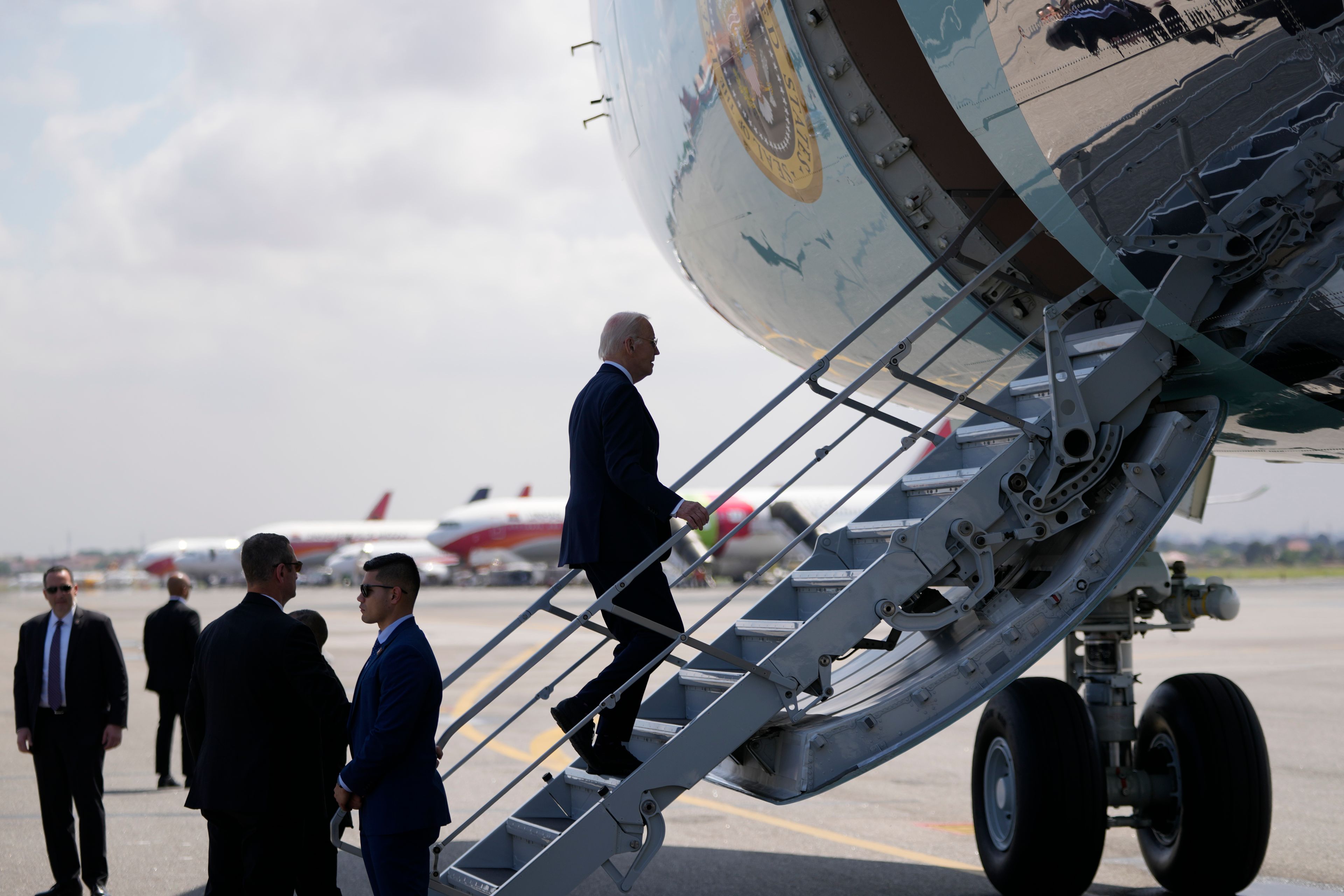 President Joe Biden boards Air Force One at Quatro de Fevereiro International Airport in Luanda, Angola, on Wednesday, Dec. 4, 2024. (AP Photo/Ben Curtis)