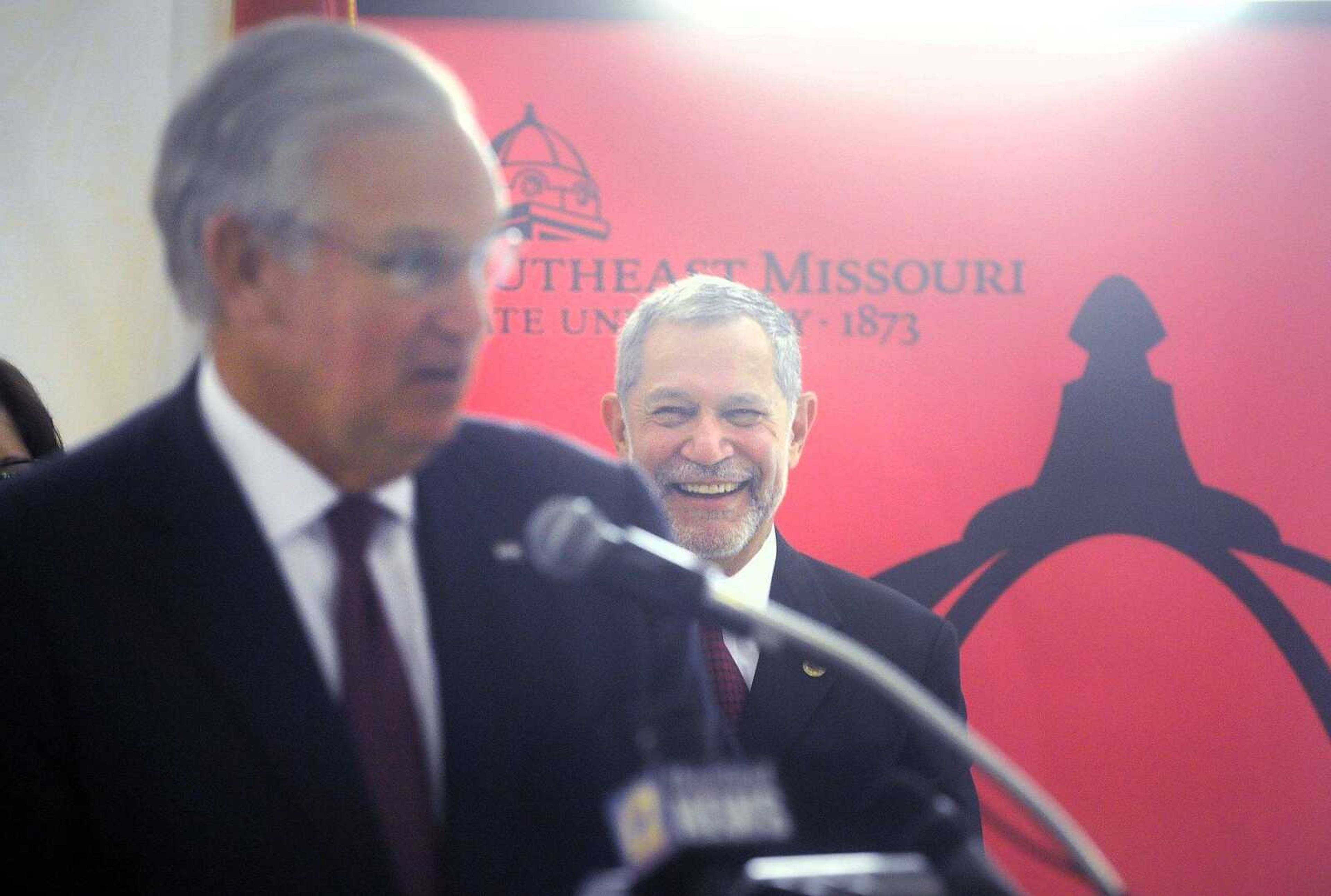 Southeast Missouri State University's new president, Carlos Vargas-Aburto, smiles in the background Monday as Missouri Gov. Jay Nixon announces more than $10 million in renovations to the university through Building Affordability at the Grauel Building. (Laura Simon)