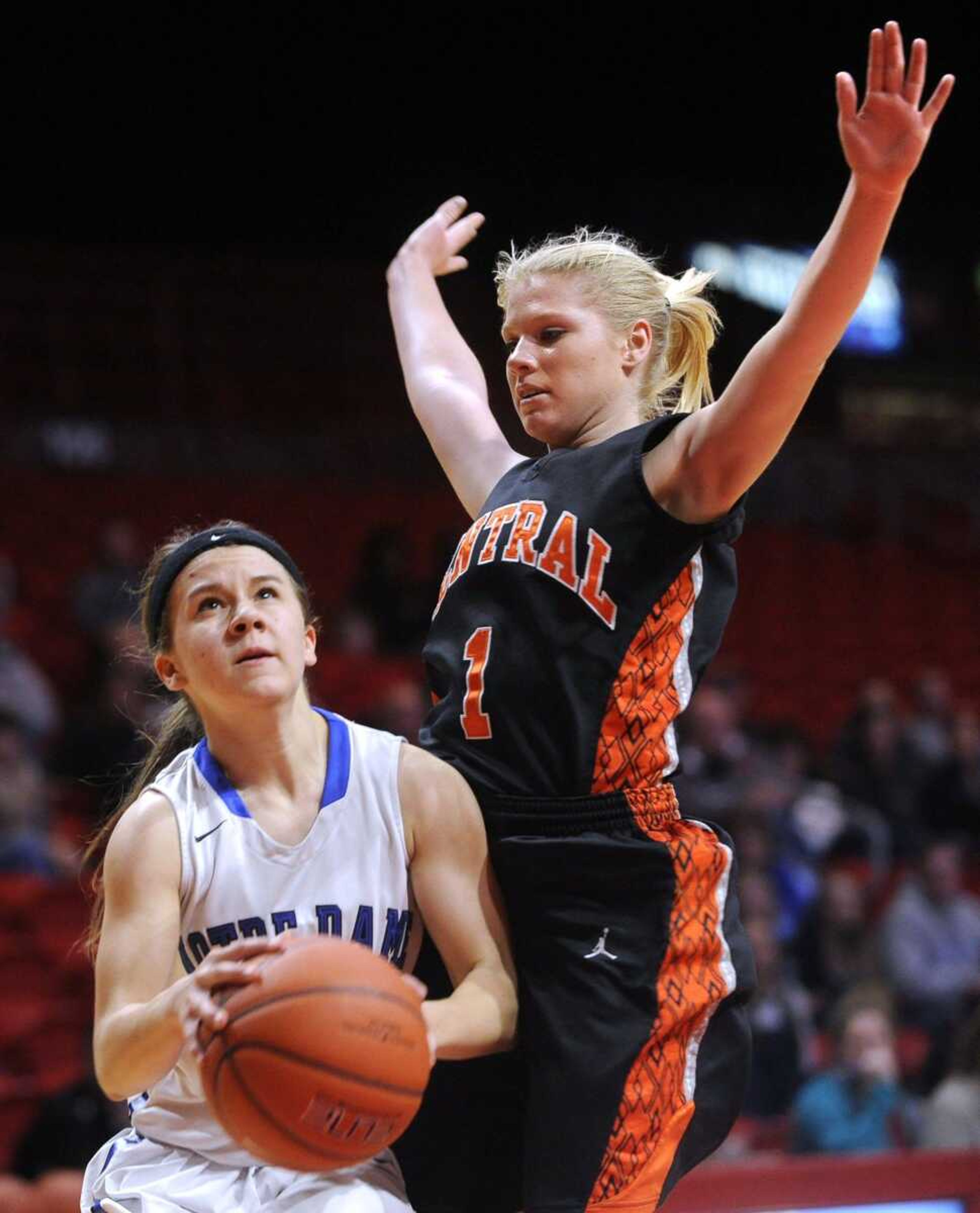 Notre Dame's Faith Essner drives to the basket as Cape Central's Kassidy Gowan defends during the fourth quarter in a first-round game of the Kelso Supply Holiday Classic on Sunday at the Show Me Center. Notre Dame won 53-37. (Fred Lynch)